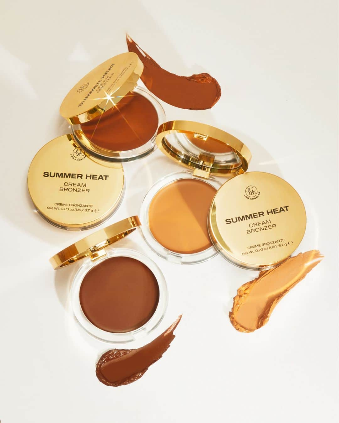 BH Cosmeticsのインスタグラム：「Get that sun-soaked, post-beach glow all year round with our *new* SUMMER HEAT Cream Bronzers 🏖️☀️ Weightless, soft cream formula delivers the most dewy bronzed finish of your dreams 💭 Leave a 😍 in the comments if you're swipin' on sun-kissed radiance 👇⁣ ⁣ ☀️ Available in 3 shades⁣ ☀️ Soft dewy, bronzed finish⁣ ☀️ Buildable and blendable weightless cream formula⁣ ⁣ Vegan. Cruelty-Free. Clean Ingredients.」