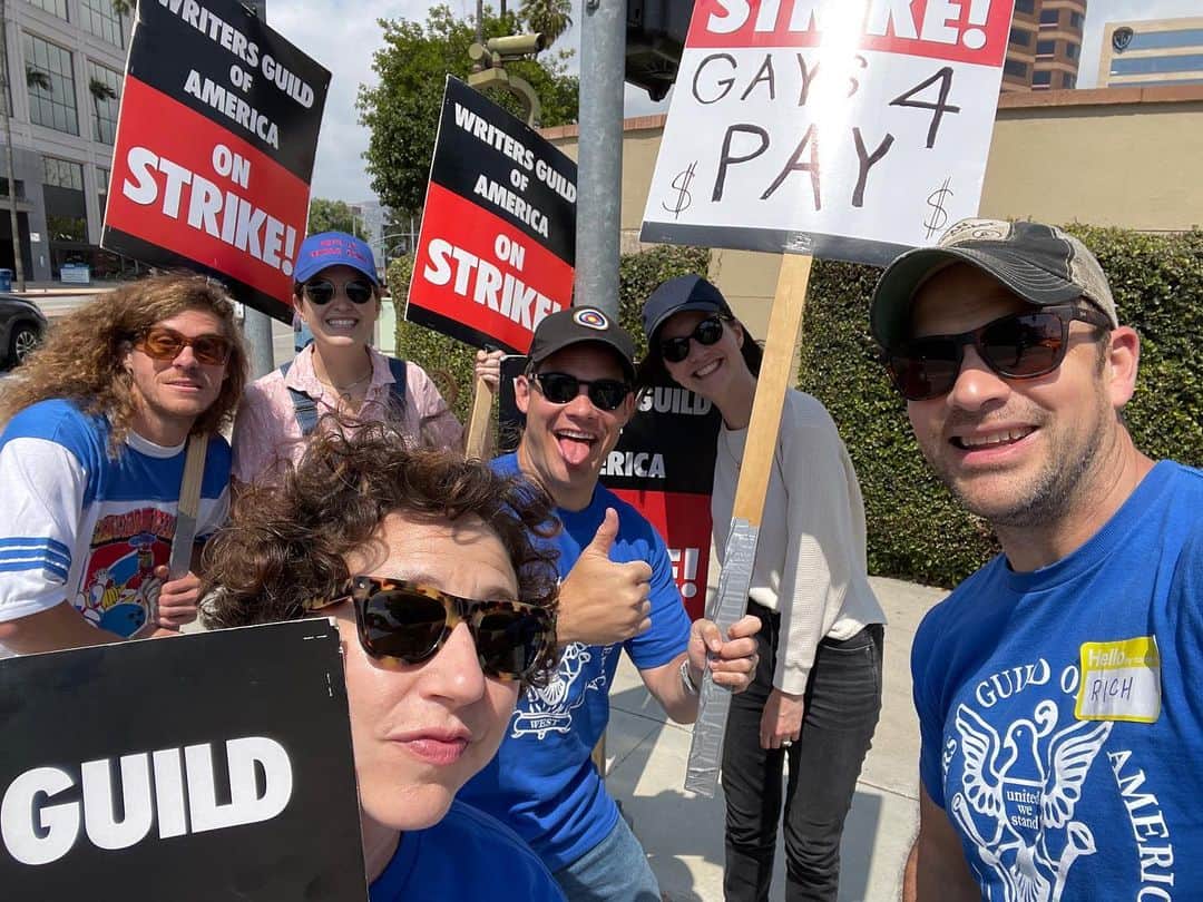 アダム・ディバインのインスタグラム：「I asked for a sign and they said “we have the perfect sign for you”. THEY WERE RIGHT! It’s important that the gays and non gay WGA writers get paid!!!」