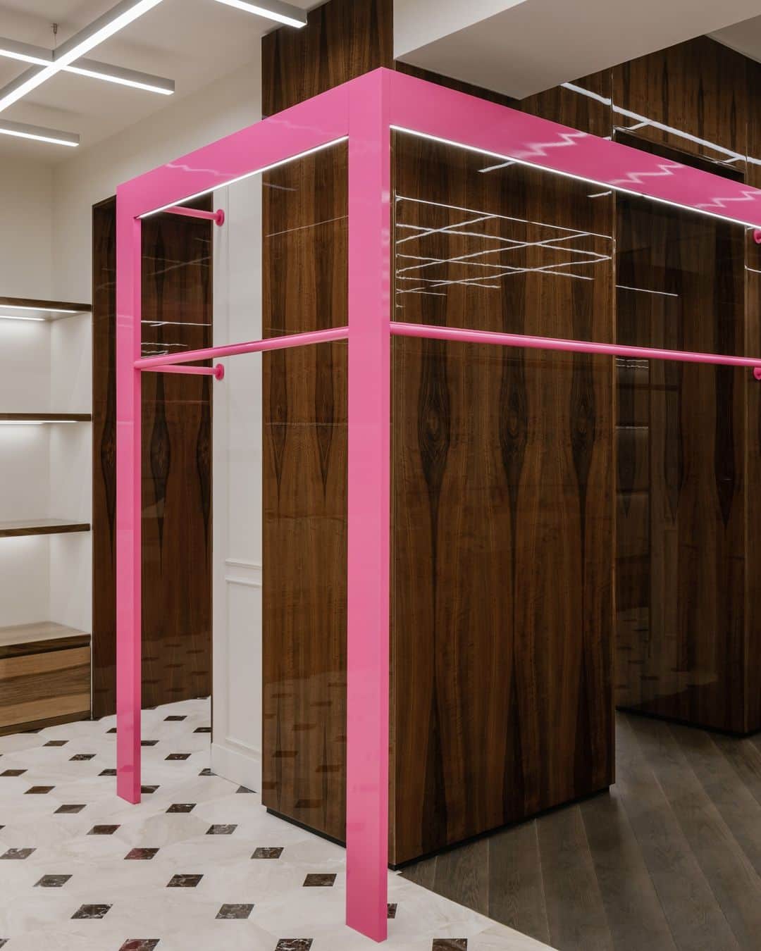 パーム・エンジェルスのインスタグラム：「Geometric sequences of pink rails and neon lights provide a lift to the future to the polished mahogany displays and shiny marble flooring.  Now Open: Rue Saint Honoré, 217 Paris.」