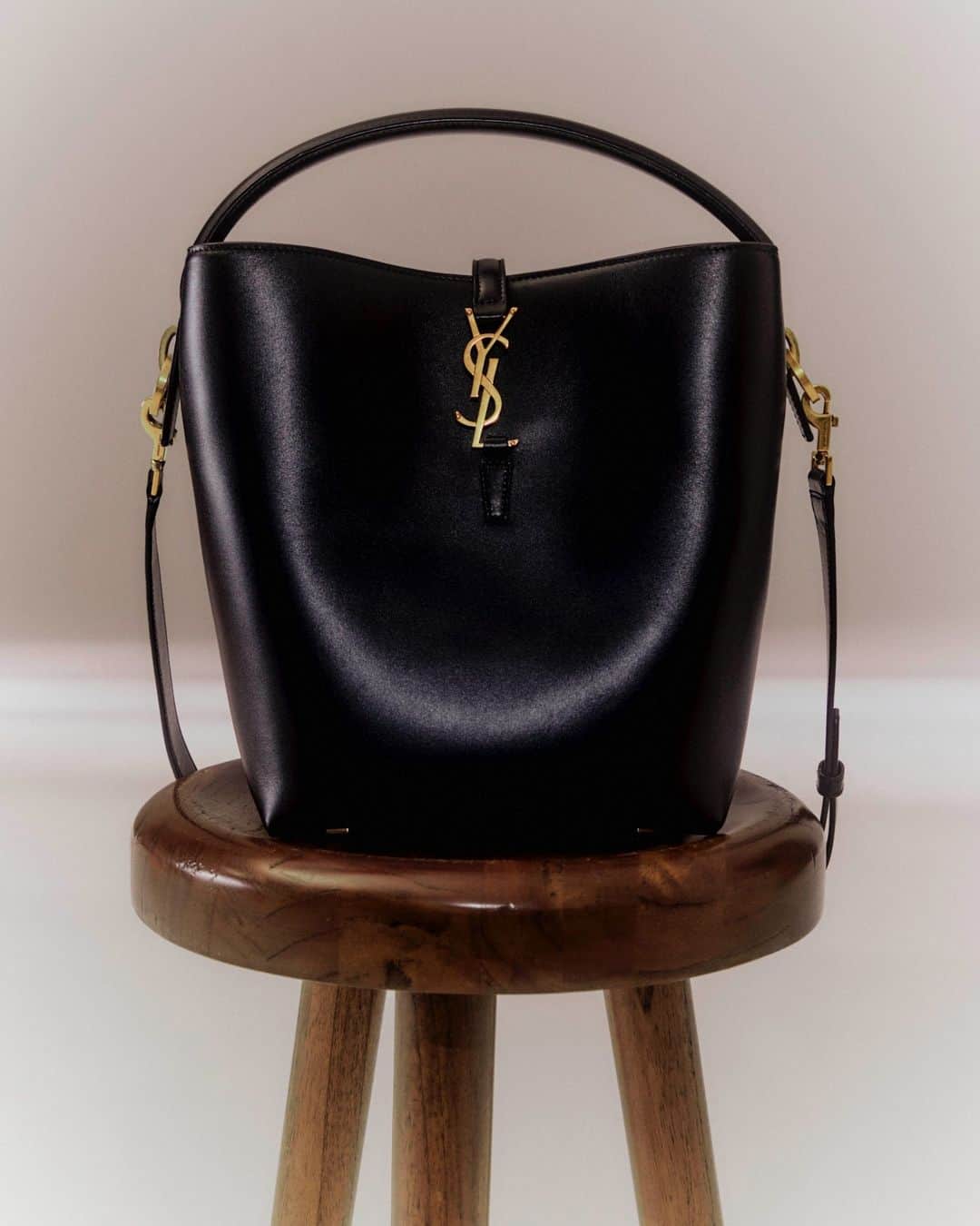 MATCHESFASHION.COMのインスタグラム：「This black leather @ysl bag with gold hardware is a sound investment – endless 24/7 styling possibilities for years to come.」