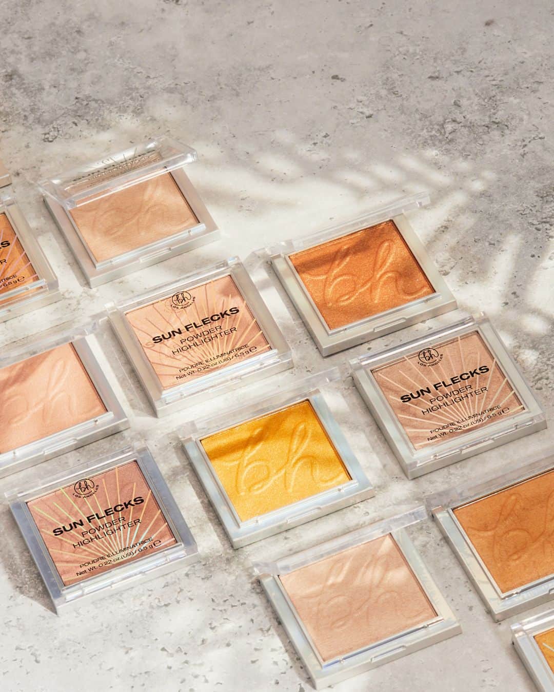 BH Cosmeticsのインスタグラム：「Catch allll the rays & shine in all the right ways with our ✨new✨ SUN FLECKS Highlighters ☀️ 5 lightweight, soft-focus pressed powder highlighters that make golden hour, every hour 👏🤯 Grab your go-to brush & sweep on the glow for a natural, sheer radiance, or apply it wet for an ultra-gleam effect 💫⁣ ⁣ Available in 5 universally-flattering shades⁣ ☀️ Beverly Hills: Burnt champagne⁣ ☀️ Bel Air: Gleaming Incandescent Opal⁣ ☀️ Cali Summer: Soft golden bronze⁣ ☀️ Golden State: True Gold⁣ ☀️ Sun Chaser: Pearly pink with a hint of peach⁣ ⁣ How To Use 👇⁣ Apply it to the highest points of your face, the inner corners of your eyes, and wherever else you want to beam bright!⁣ ⁣ 🌱 Vegan 🐰 Cruelty-Free 🧼 Clean Ingredients⁣ ⁣ #bhcosmetics」