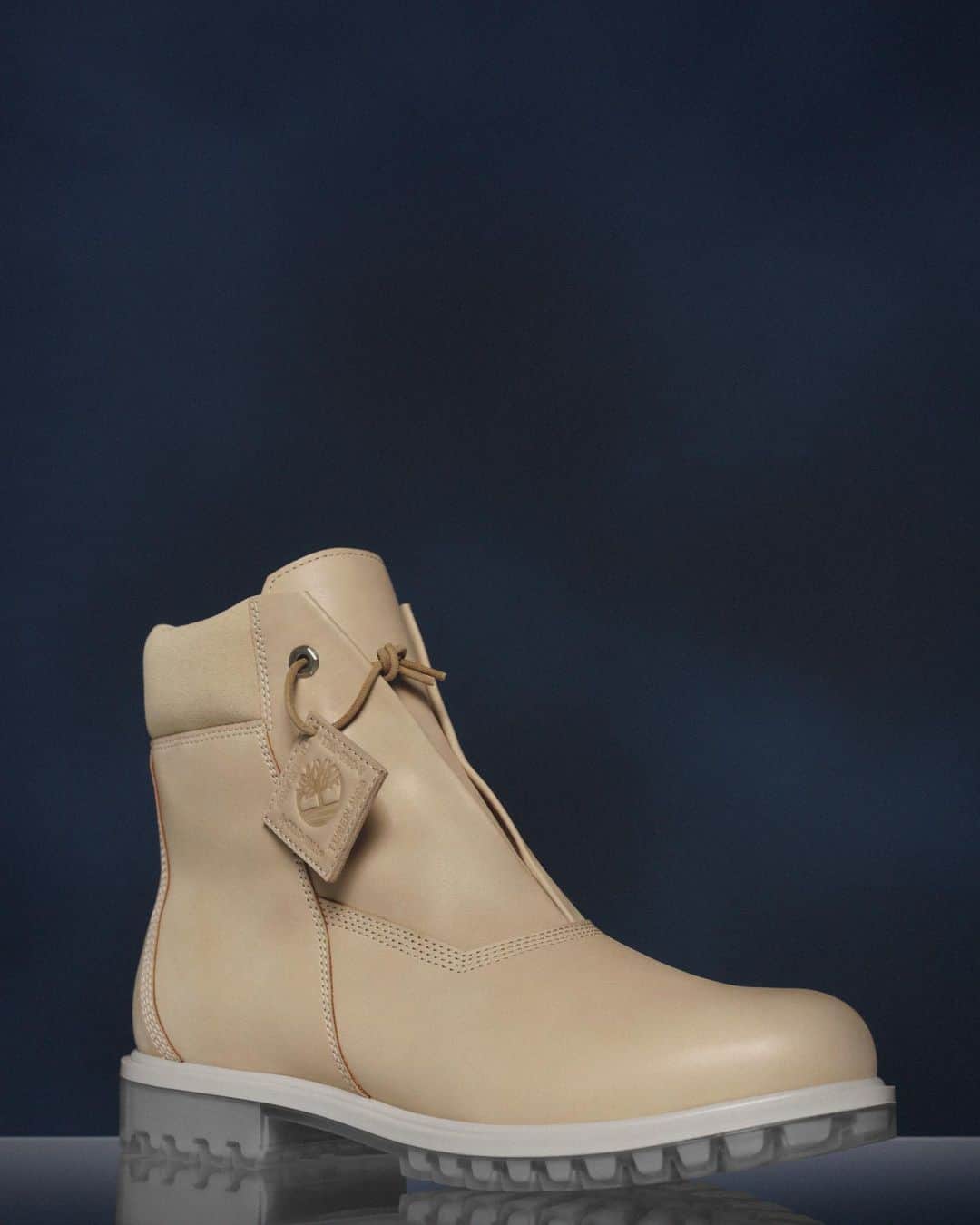 ティンバーランドのインスタグラム：「The Original Timberland® Boot moves future forward in the Timberland x A-COLD-WALL* Future73 6-inch Zip Boot. ⏩​ ​ The asymmetrical cut of the premium leather upper features a side-zipper to put on and take off with ease. The off-white outsole with clear lugs adds a layer of polish, and serves as a canvas to be decorated from the steps of your adventures over time.​ ​ The collection also features a hunting parka, knit sweater, brushback cotton crewneck, insulated vest and cargo shorts that are made with materials to take on the cityscapes and natural terrain.​ ​ Hit the link in bio to shop the collection.​ ​ #Future73​ #Timberland50​ #BuiltForTheBold」