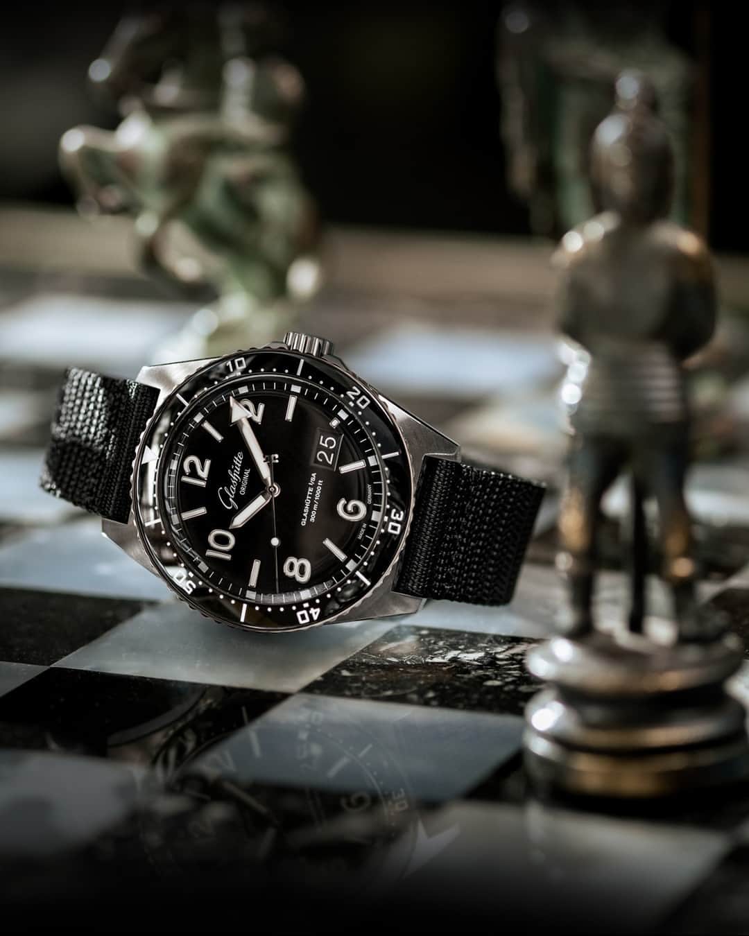 グラスヒュッテのインスタグラム：「In the pursuit of greater sustainability, every move is of importance. That's why we're proud to introduce our new black synthetic straps. Like our other nylon mesh straps, they offer not only maximum wearing comfort and a sporty, elegant look but are also made of a yarn that is 100% made from recycled fishing nets. In short: they are the perfect complement to our timepieces – such as our SeaQ Panorama Date with black dial. Proud to be the Original.  #GlashütteOriginal #GlashuetteOriginal #PTBTO #SeaQPanoramaDate #OceanPlastic #Sustainability」