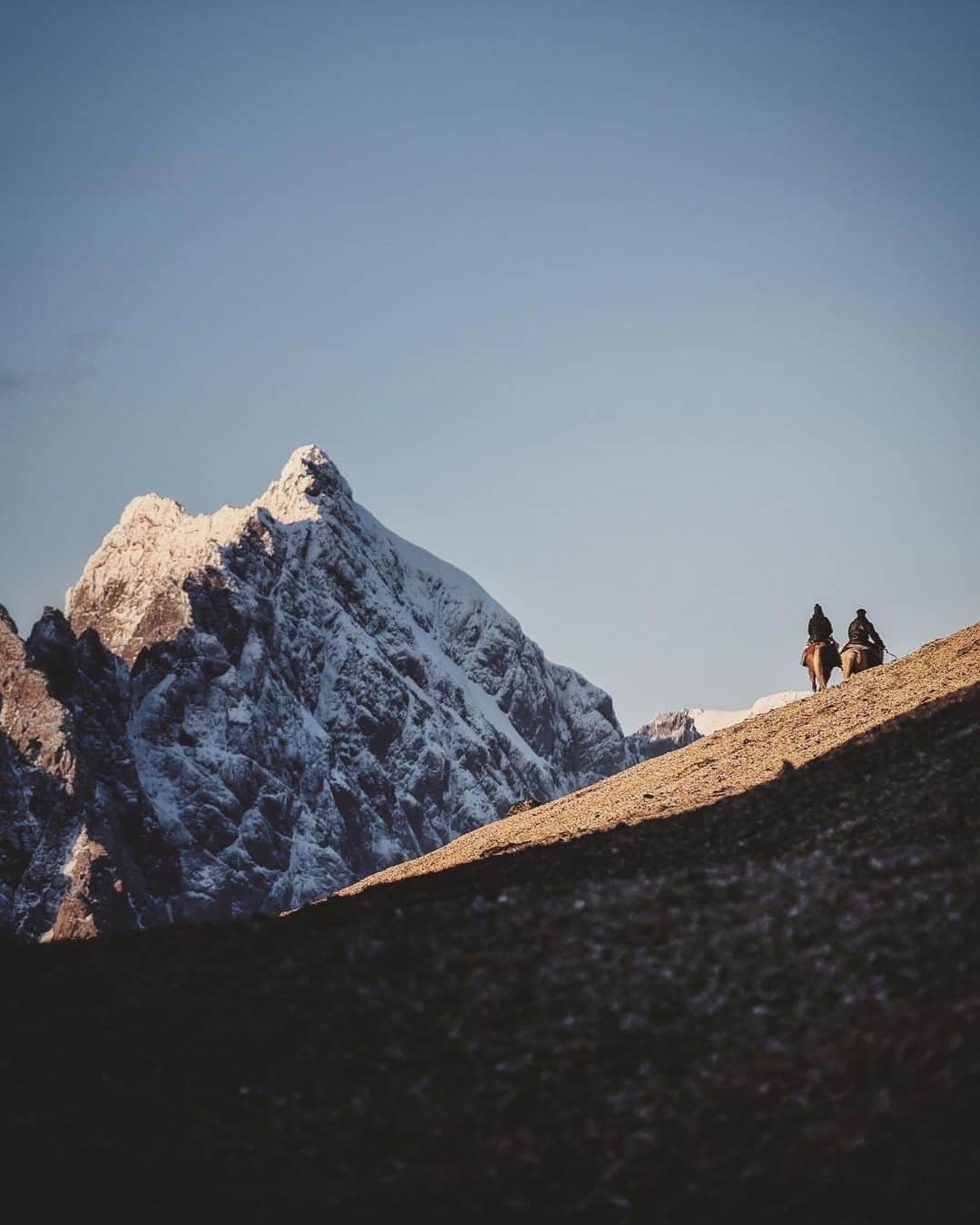 ナショナルジオグラフィックさんのインスタグラム写真 - (ナショナルジオグラフィックInstagram)「Photos by @jimmychin | The film "Wild Life" has been six years in the making. @chaivasarhelyi and I follow conservationists Kristine and the late Doug Tompkins on an epic, decades-spanning love story as wild as the South American landscapes they dedicated their lives to protecting.  Along the way, we worked with Pascual, who led the horse-packing team, carrying gear, production equipment, and supplies for our climb of Cerro Kristine, as seen in the film—a peak first climbed (and named) by Doug in 2009. We couldn’t have done it without Pascual's support and his incredible team.  Pascual is a gaucho. His fortitude and temperament were forged by the windswept landscape of the Patagonian Andes. Watching him ride his horse on steep, third-class terrain while trailing loaded pack horses made me feel like I’d never taken any real risks in my life.  We learned a lot from him. Among other things, we watched, eyes wide and mouths agape, his routine for making coffee over the campfire. After boiling what's known as cowboy coffee, Pascual would pick up the wire handle of the brimming, open pot, then casually windmill it, straight-arm, for 2 minutes until coffee grounds were pressed to the bottom of the pot. He would then serve it hot to everyone around the fire. We called it the gaucho press. All of this is to say, We were very impressed with Pascual.  And we're incredibly excited to share the film with you on @disneyplus and @hulu starting May 26. @tompkins_conservation」5月19日 1時00分 - natgeo