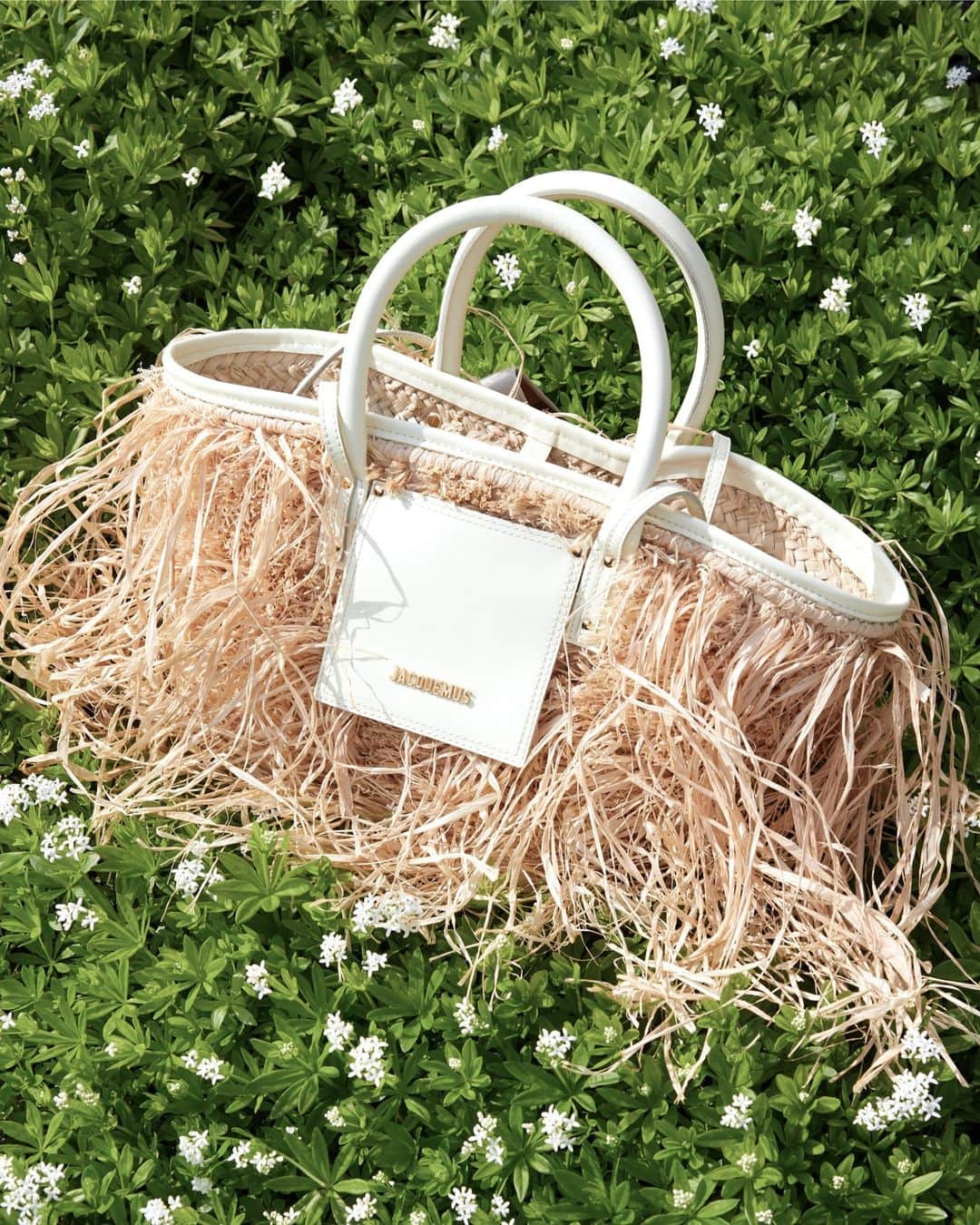 MATCHESFASHION.COMのインスタグラム：「Get beach-ready: bring a playful dimension to pared-back vacation looks with @jacquemus’ fringed faux-raffia Soli.」