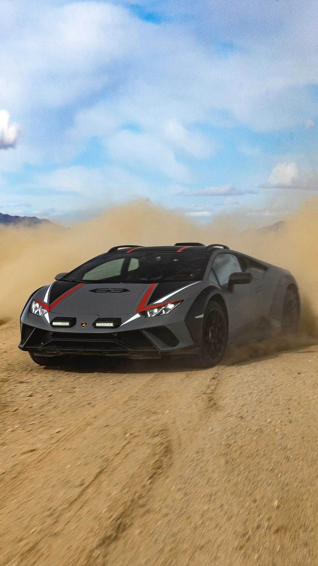 ランボルギーニのインスタグラム：「Sporty and bold. And finally ready to take off!  These are the features of Lamborghini Huracán Sterrato that were emphasized during its first dynamic launch in Chuckwalla circuit in California.  The most efficient way to put its V10 engine and specific calibrations for Road and Sport and the new Rally mode to the test.  For those who love adventures, even on wheels.    #Lamborghini #HuracanSterrato #BeyondTheConcrete  __  Huracán Sterrato: fuel consumption combined: 14,9 l/100km (WLTP); CO2-emissions combined: 337 g/km (WLTP)」