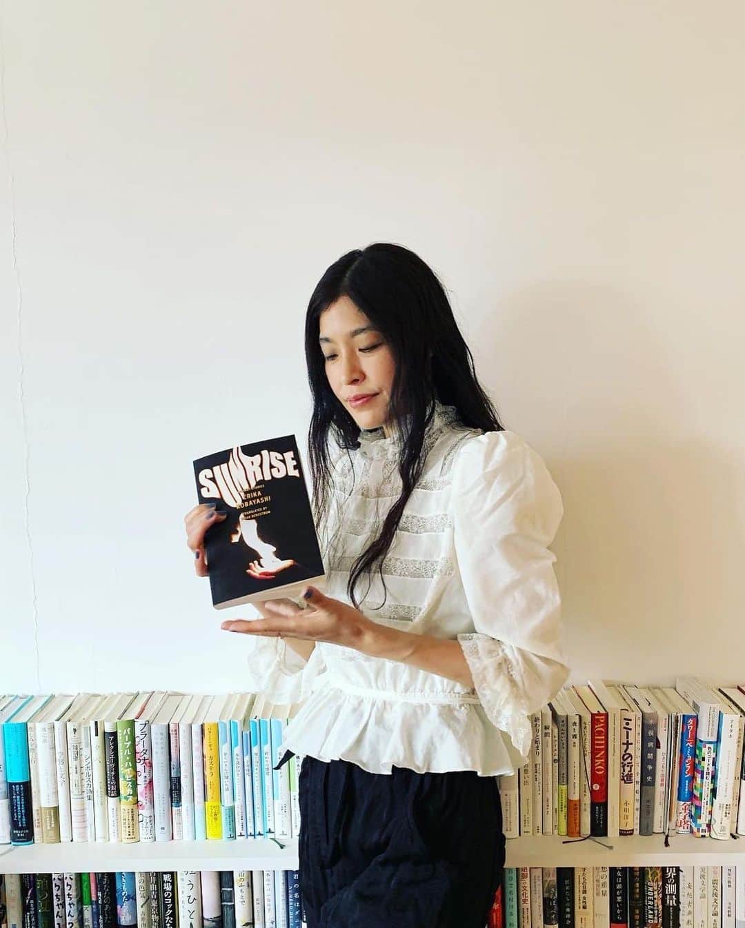 小林エリカのインスタグラム：「My second English translated book!!!! Short story collection “Sunrise -Radiant Stories-“  Erika Kobayashi  Translated by Brian Bergstrom @asa_no_burei  Published by Astra House @astrahousebooks  Thanks @lisetteverhagen   Cover photo is In My Hand— The Fire of Prometheus, 2019 Photo by Kasane Nogawa (c) Erika Kobayashi and Yutaka Kikutake Gallery   The words from the authors who I respect means lots to me❤️‍🔥🔥❤️‍🔥 Thanks @kalimaja @prabdayoon @leeconell   英語翻訳の2冊目短編集「Sunrise -Radiant Stories-」がアメリカ🇺🇸カナダ🇨🇦で発売になります！  #sunrise #erikakobayashi #brianbergstrom #radiantstories」