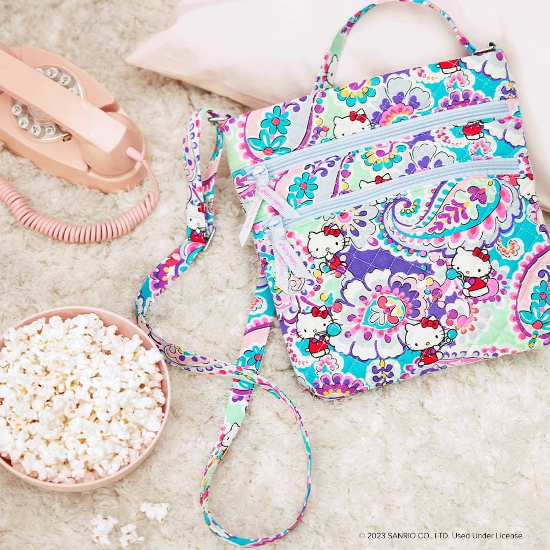 ヴェラブラッドリーのインスタグラム：「A favorite crossbody style with a new candy-colored design is the perfect choice for all your summer adventures spent with friends! Tap to shop the Triple Zip Hipster!  @HelloKitty #VeraBradley #pattern #HelloKitty」