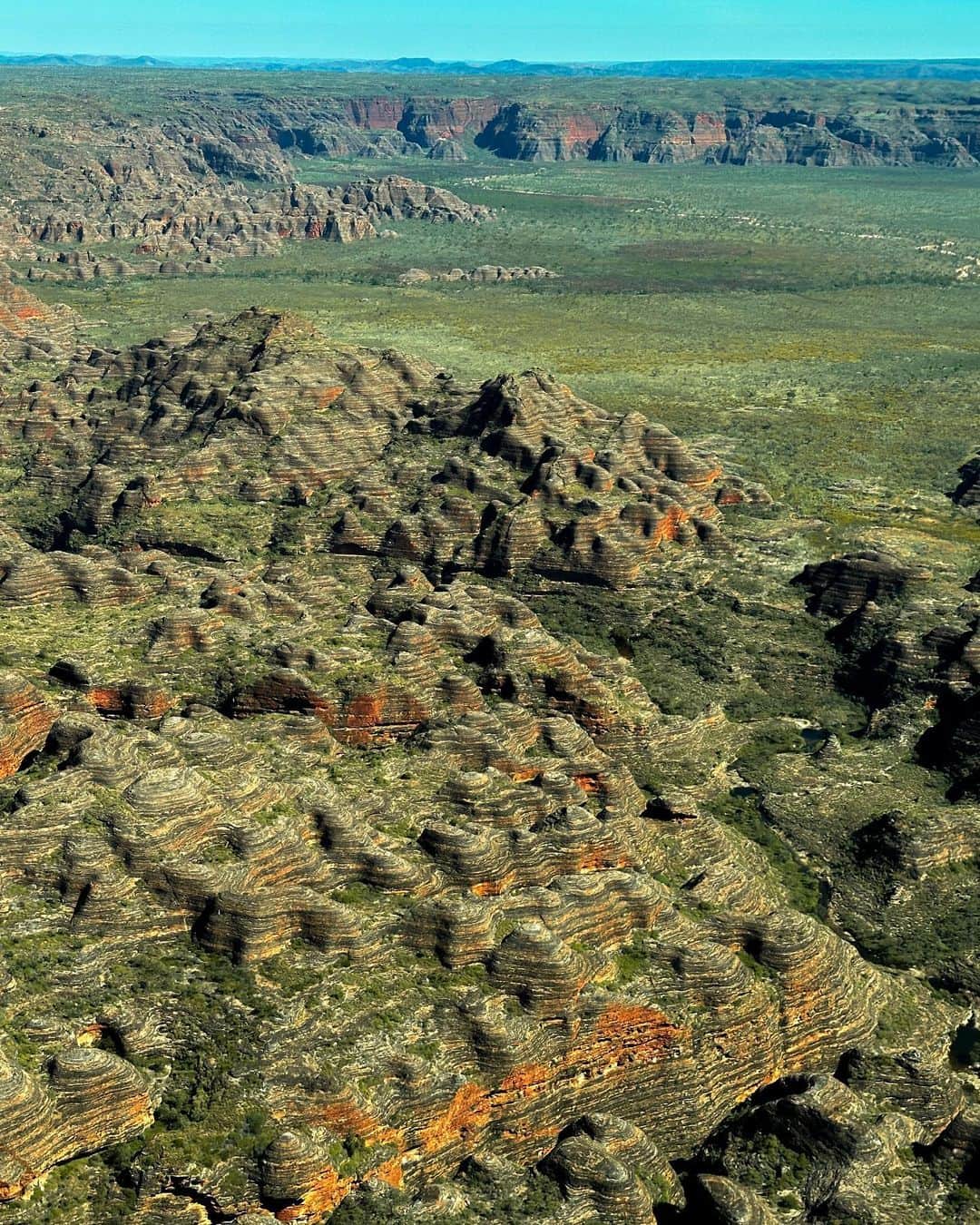 フェリシティー・パルマティアーのインスタグラム：「Crossing off a long-awaited dream from the bucket list - the World Heritage Listed, Bungle Bungle Range in Purnululu National Park. This iconic destination captured my heart, with its towering sandstone domes and timeless allure. From the vibrant colours to the rugged beauty, the Bungle Bungles exceeded my expectations ❤️🧡💛  Our @bunglebungleguidedtours was EPIC! JB and Gabriel were so insightful and made it such a memorable experience. Really looking forward to coming back and exploring more one day.  @westernaustralia @australiasnorthwest @aviairwa @thekimberleyaustralia #WAtheDreamState #SeeAustralia」