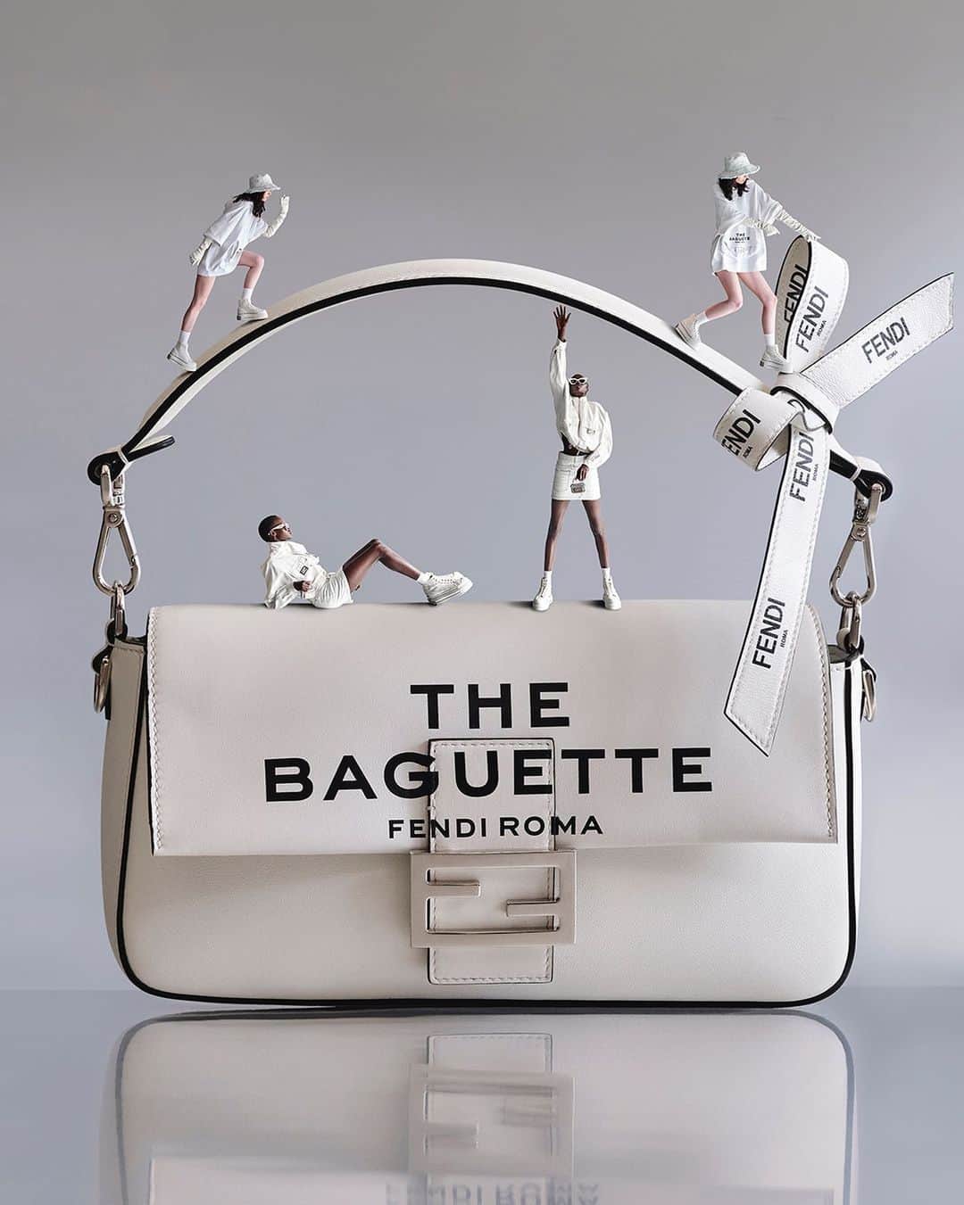 Fendiのインスタグラム：「Out loud. Statement lettering and ribbons inspired by the Maison's packaging amplify the iconic spirit of the #FendiBaguette in #MarcJacobsXFendi.  Artistic Director of Couture and Womenswear: @mrkimjones​ Artistic Director of Accessories and Menswear: @silviaventurinifendi ​ Artistic Director of Jewelry: @delfinadelettrez​ Artistic Director: @themarcjacobs   Photography: @johnyuyi  Styling: @elliegracecumming  Hair: @evaniefrausto Makeup: @marcelogutierrez  Casting: @shelleydurkancasting Set Design: @mattjacksonmattjackson  Models: Nyalit Laul, Shelby Smith」