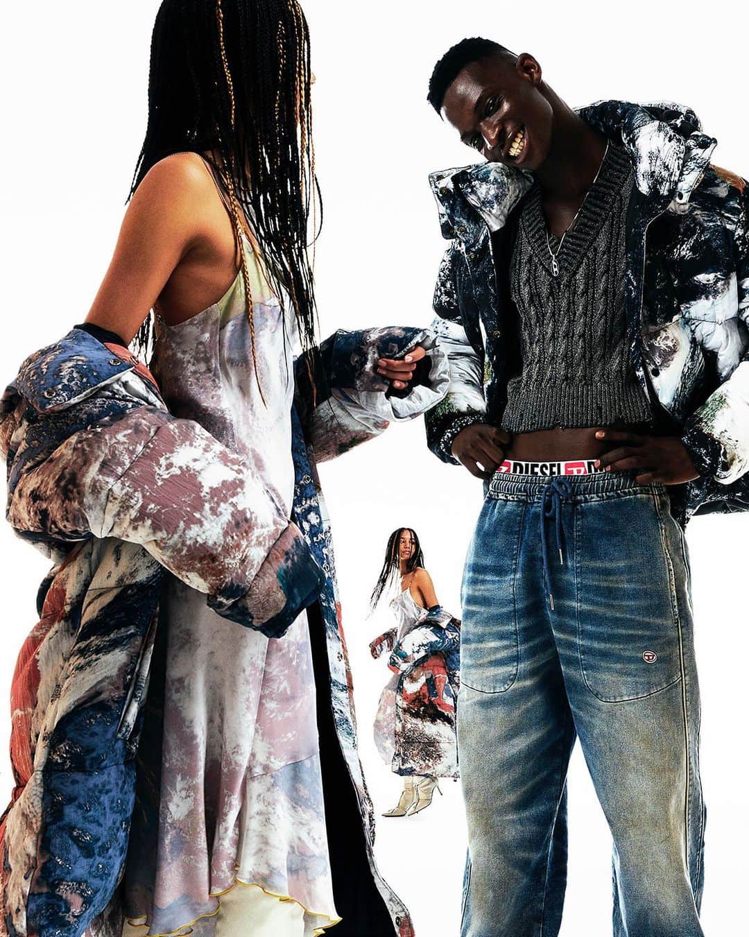 ディーゼルのインスタグラム：「Partly sunny.   The Planet Camo range blends with different moods and different forecasts. Prints of the Earth’s atmosphere applied as a camouflage motif take on a soft expression on a puffer jacket and soft slip dress for women and a graphic edge in black-and-white on a men’s jacket.   Discover more at the link in bio.  #ForSuccessfulLiving」
