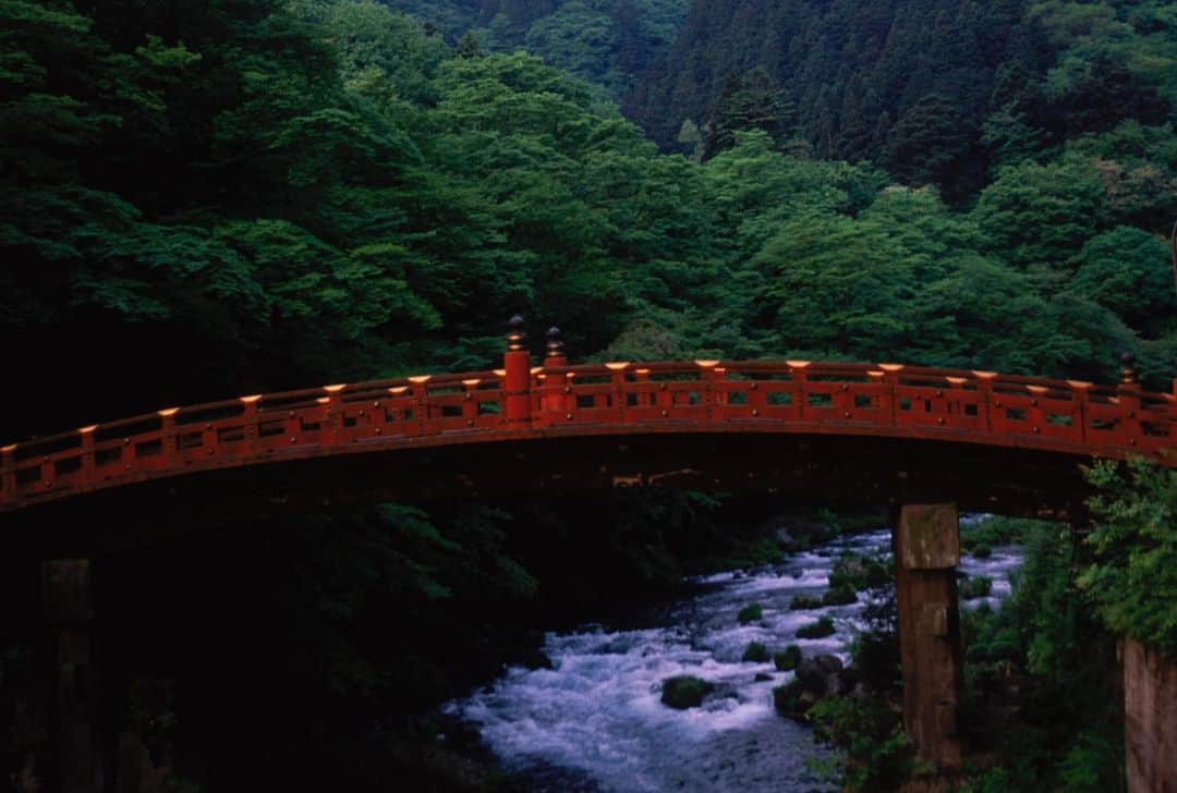 Michael Yamashitaのインスタグラム：「Red bridge and spring green, Nikko, Japan: Standing at the entrance to Nikko Toshogu Shrine, the Shinkyo or 'sacred bridge' is a can't miss landmark. It’s also the gateway to the other side of Nikko, the  National Park centered around Chuzenjiko, Japans highest lake and one of my favorites for its quiet beauty. #nikko #nikkonationalpark #shinkyobridge」