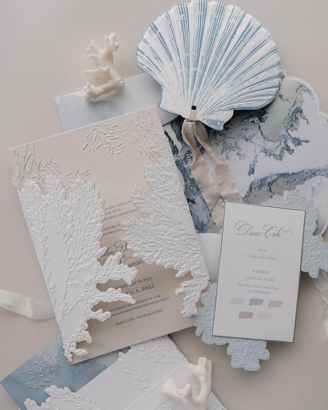 Veronica Halimさんのインスタグラム写真 - (Veronica HalimInstagram)「A custom wedding suite design for H&J that captures the ocean's beauty. Using abstract marble patterns in the liner, we brought out the texture and colors of the sea.  ⠀⠀⠀⠀⠀⠀⠀⠀⠀ We explored different visual and print finishes to enhance the suite's appeal and showcase the textures of coral, shell, and sea waves bundled together, creating a wonderful unwrapping experience. ⠀⠀⠀⠀⠀⠀⠀⠀⠀ Thank you for trusting us to create freely from start to finish. Creating this suite was an absolute joy for us! —  #truffypi #カリグラフィー #カリグラフィースタイリング #モダンカリグラフィー #calligraphystyling #weddinginvitation #weddingstationery #moderncalligraphy #embossed  #paperlovers #ウェディング #ウェディングアイテム #カリグラファ #veronicahalim #スタイリング #prettypapers #weddingsuite #bali  #ldvh #amankila #baliwedding」5月21日 11時35分 - truffypi