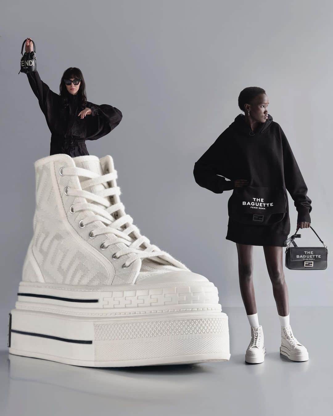 Fendiのインスタグラム：「Runway inspiration. In #MarcJacobsXFendi, the Domino high-top sneaker silhouette is elevated with a double sole, drawing from the #FendiBaguette anniversary show.  Artistic Director of Couture and Womenswear: @mrkimjones​ Artistic Director of Accessories and Menswear: @silviaventurinifendi ​ Artistic Director of Jewelry: @delfinadelettrez​ Artistic Director: @themarcjacobs   Photography: @johnyuyi  Styling: @elliegracecumming  Hair: @evaniefrausto Makeup: @marcelogutierrez  Casting: @shelleydurkancasting Set Design: @mattjacksonmattjackson  Models: Nyalit Laul, Shelby Smith」