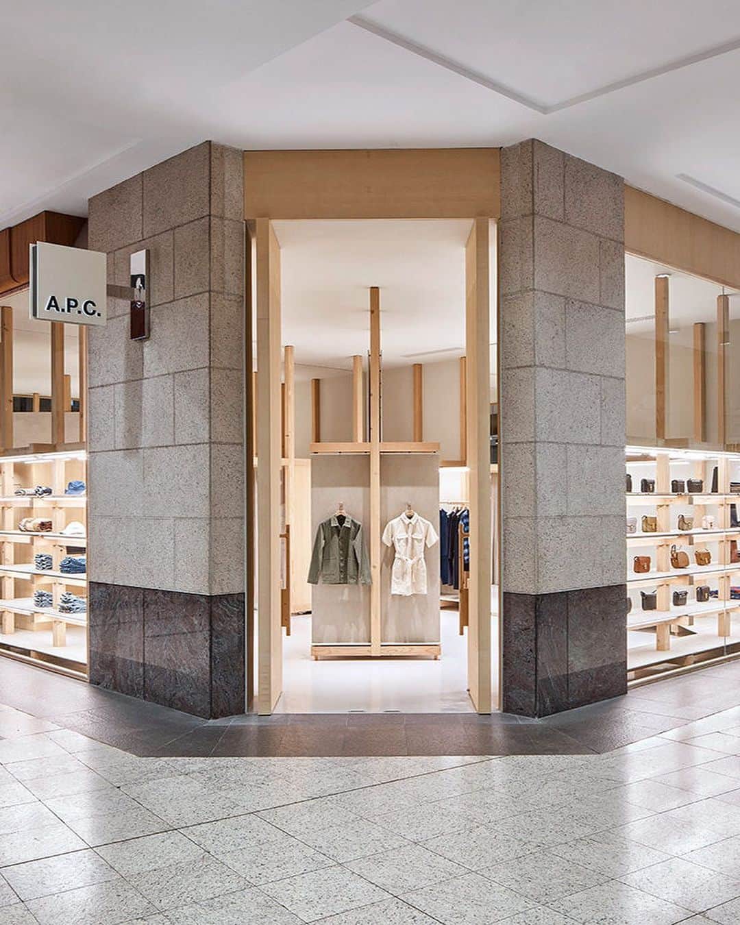 アーペーセーのインスタグラム：「A.P.C. Sydney is now open.  Designed by @laurentderooarchitecte A.P.C. Sydney plays on the contrasts between light wood frames and concrete panels, highlighted by a white floor that reinforces the impression of clarity. This graphic dialogue between organic and industrial, already present in the A.P.C. store in Melbourne, structures the space, treated as a neutral box.   Drop by to discover our timeless pieces and new PF23 accessory and ready-to-wear arrivals.   A.P.C. Sydney Shop RG007 The Galeries 500 George St, Sydney NSW 2000  #APCParis #APCStore」