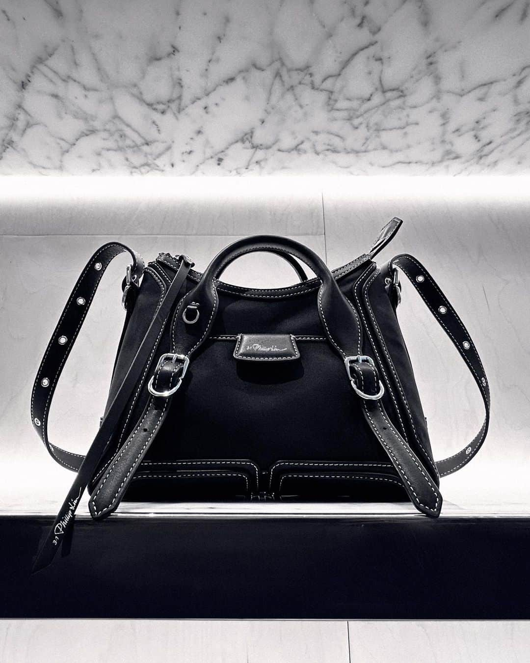 3.1フィリップリムのインスタグラム：「Black magic. - The PASHLI Moto Satchel from PRE FALL 2023 - The newest iteration in the cult heritage PASHLI family, the moto has evolved from a bicycle bag to a deconstructed version with motorcycle details.」