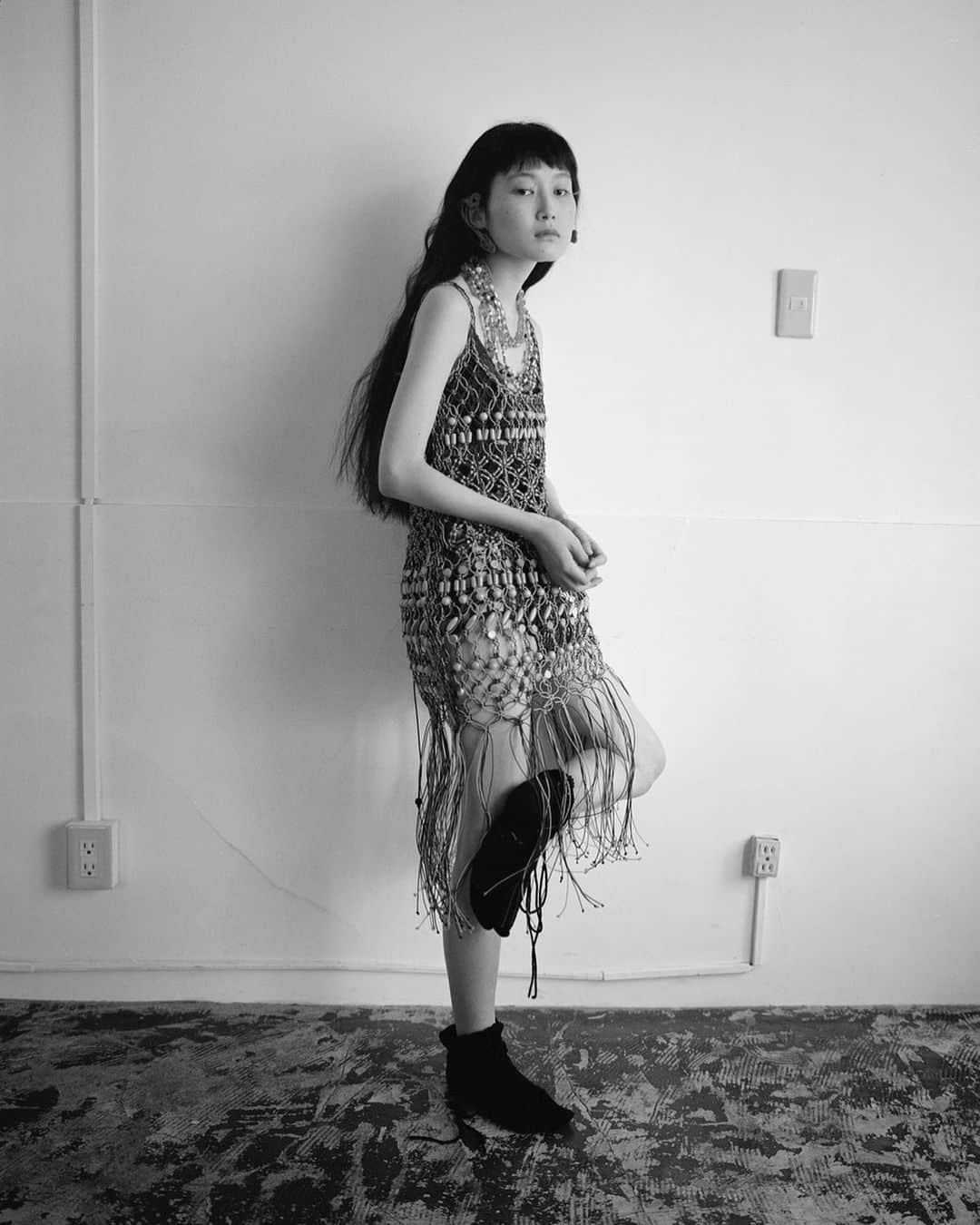黒河内真衣子のインスタグラム：「SS23 Bamboo Beaded Macrame Camisole Fringe Dress and Cord Embroidery "Hanakago" Bustier worn underneath featured in @kingkongmagazine   #mamekurogouchi」