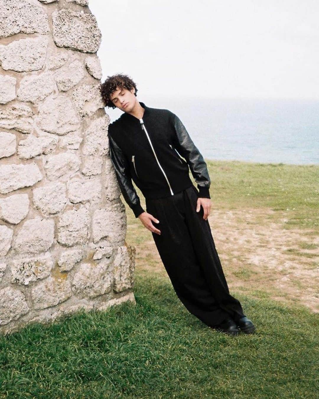 マッカージュのインスタグラム：「MONDE MACKAGE   @william_.e wears GEE, an oversized slightly cropped bomber jacket made from responsibly sourced double face virgin wool. It features water resistant and repellent (R) Leather sleeves made using a chrome-free tanning process. Rib knit collar, cuffs, and hem add ease and comfort, and contrast sleeves nod a the classic varsity style. An embossed word mark on the sleeve adds a textural accent. A modern upgrade on a heritage style.   More on MACKAGE.COM   #MACKAGE #MONDEMACKAGE」