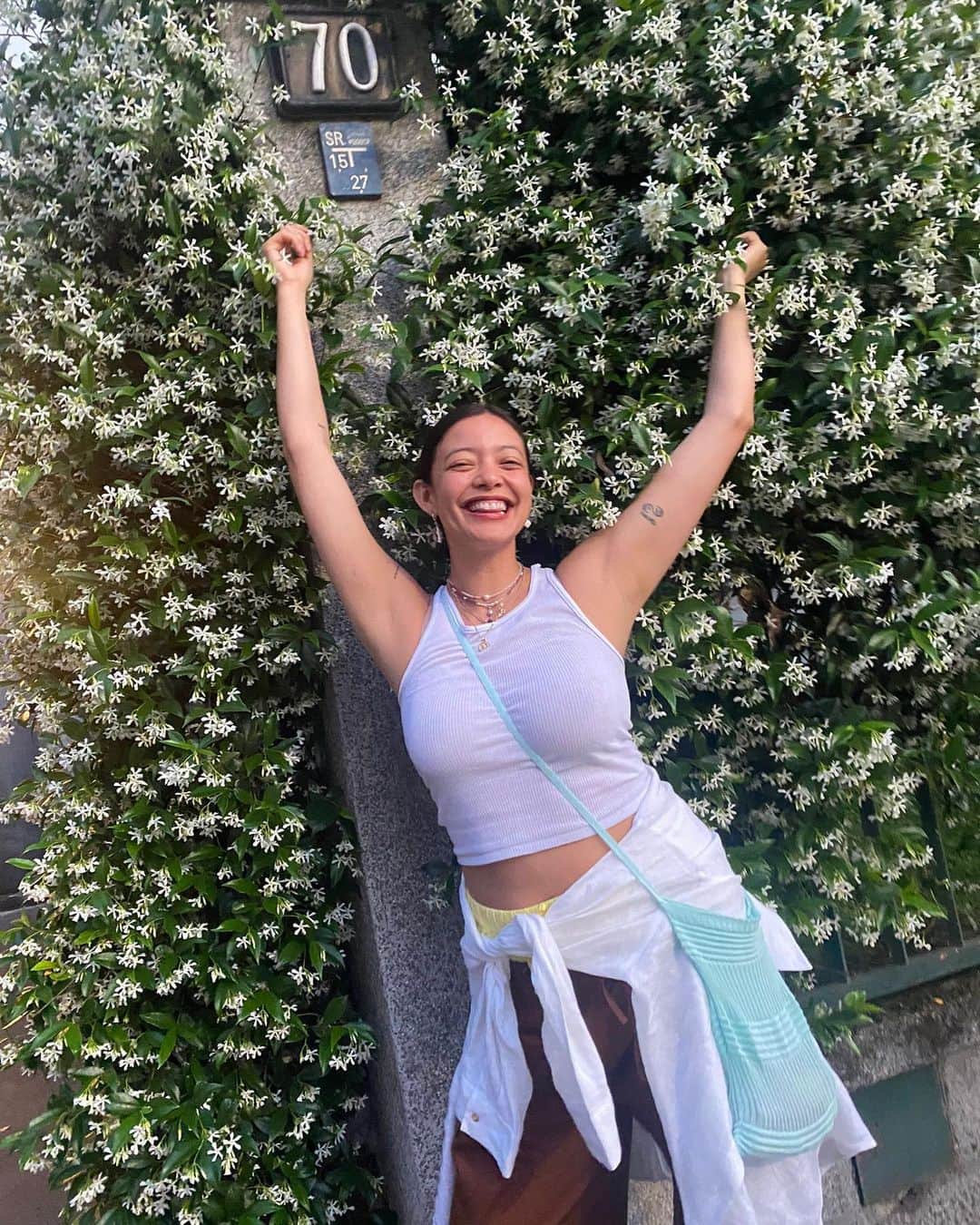 ナオミ・シマダのインスタグラム：「Your veil of the saffron colour makes my eyes drunk. The jasmine wreath that you wove me  thrills to my heart like praise. It is a game of giving and withholding,  revealing and screening again;  some smiles and some little shyness,  and some sweet useless struggles. This love between you and me is simple as a song   poem by Rabindranath Tagore translated from Bengali  (PS - it’s official! reporting from the streets, the best season in milano by far is star jasmine season! It’s literally everywhere, giving me life on ever walk and bike ride, each breath of sweetness softens my heart and makes me sweeter <3)」