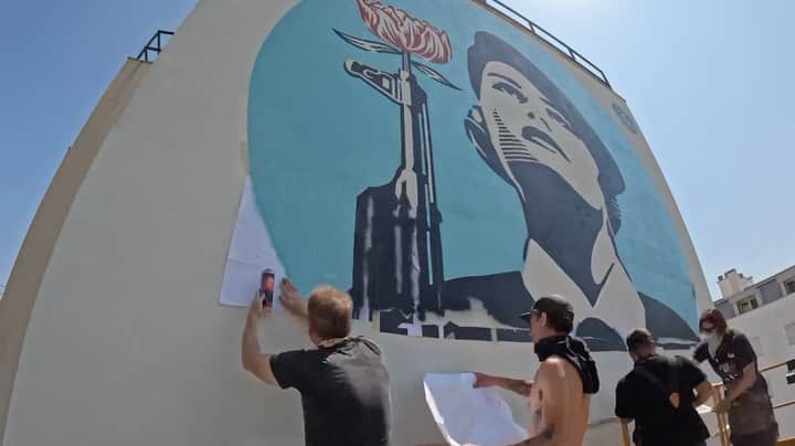 Shepard Faireyのインスタグラム：「Here’s a time lapse video from @urbanrevolution.pt open now in #LISBON! My crew and I also worked on repainting the Peace Guard mural in the Graça neighborhood. My solo show “Printed Matters: While Supplies Last” at @underdogs_gallery opens today at 6pm and on view until August 5th. I hope you can check it out! -Shepard  Video by @zagnutz  Select clips from @jonathanfurlong」