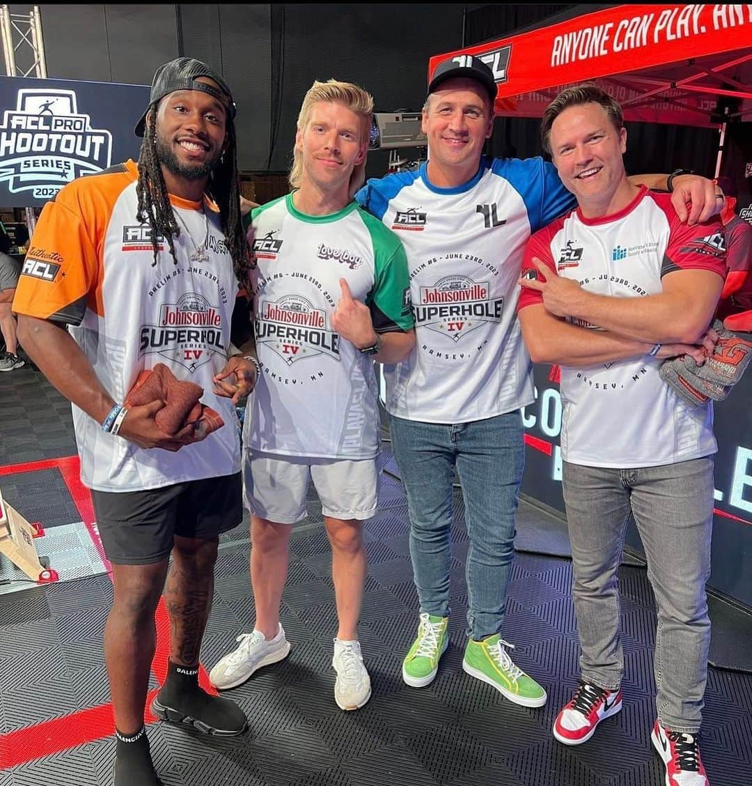 ライアン・ロクテのインスタグラム：「Was so fun watching Ryan Lochte debuting his new green suede Lochte X Riddick sneakers on ESPN’s Celebrity Cornhole tournament! Pictured here with Alexander Mattison, Kyle Cooke, and Scott Porter.   The sneakers you see Ryan wearing were designed in honor of his former favorite Olympic poolside sneakers from back in the day! They are hand-crafted in soft green Italian suede, with yellow leather piping, and “LOCHTE” logo on the side.  Available now online. Go grab a pair of your own today. 💚 ___________   #Riddickshoes - highest quality artisanal footwear.  Check out our Shop for the full collection. 👉 www.riddickshoes.com」