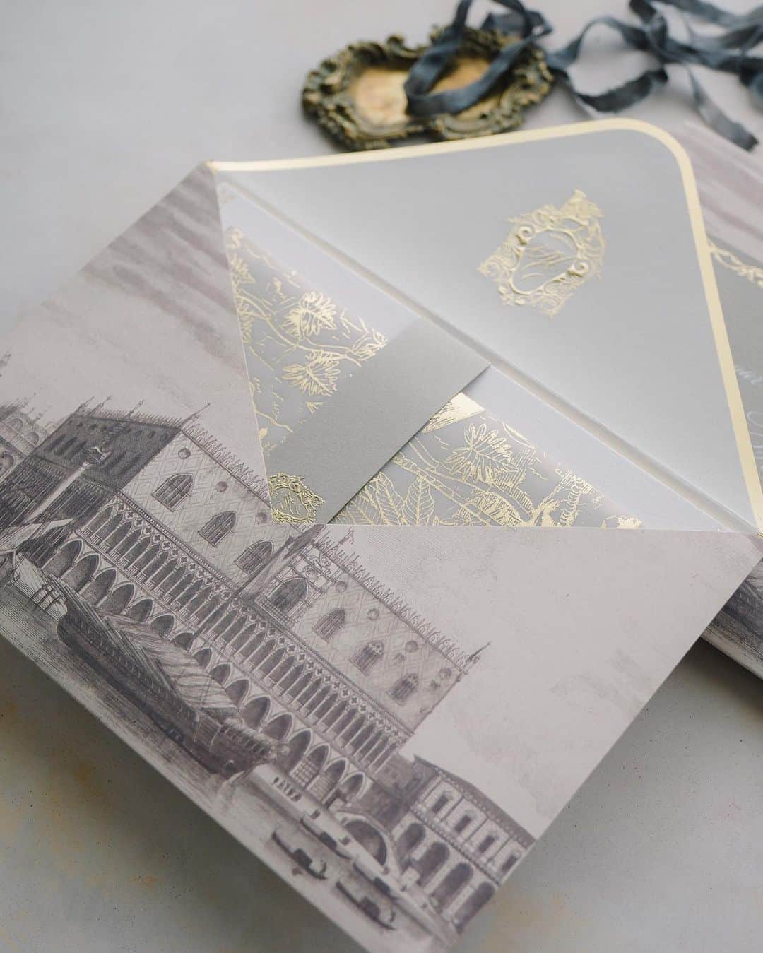 Veronica Halimさんのインスタグラム写真 - (Veronica HalimInstagram)「Experience a world of elegance and opulence with this invitation suite, meticulously crafted for a wedding at the iconic Palazzo Pisani Moretta in Venice. Every card piece showcases intricate designs, capturing the timeless allure and romantic essence of Venice's antique charm. —  #palazzopisanimoretta #destinationwedding #venicewedding #venetianwedding #truffypi  #カリグラフィースタイリング  #weddinginvitation #weddingstationery  #embossed  #paperlovers #ウェディング #ウェディングアイテム #カリグラファ #veronicahalim #スタイリング #prettypapers #weddingsuite #venice #amanvenice」6月26日 12時25分 - truffypi