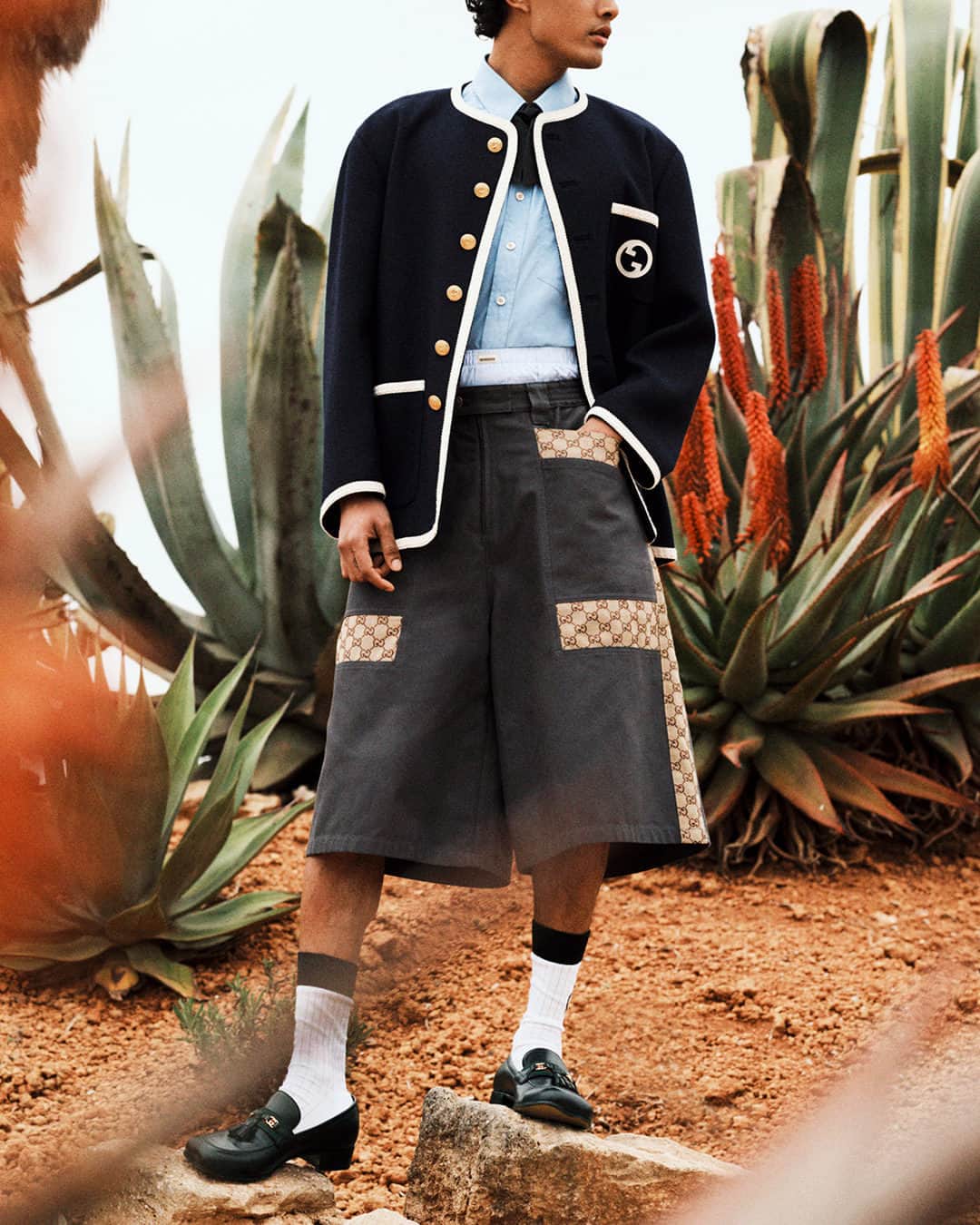 MR PORTERのインスタグラム：「Inspired by vintage military uniforms, Gucci’s tweed jacket is just the thing to smarten up and elevate your everyday looks. We’ve styled it over a bow-tie shirt, the house’s monogrammed shorts, and a pair of tasselled loafers. However, if the occasion requires a more formal approach, just dress it up with smart trousers and boots.  Tap to shop.」