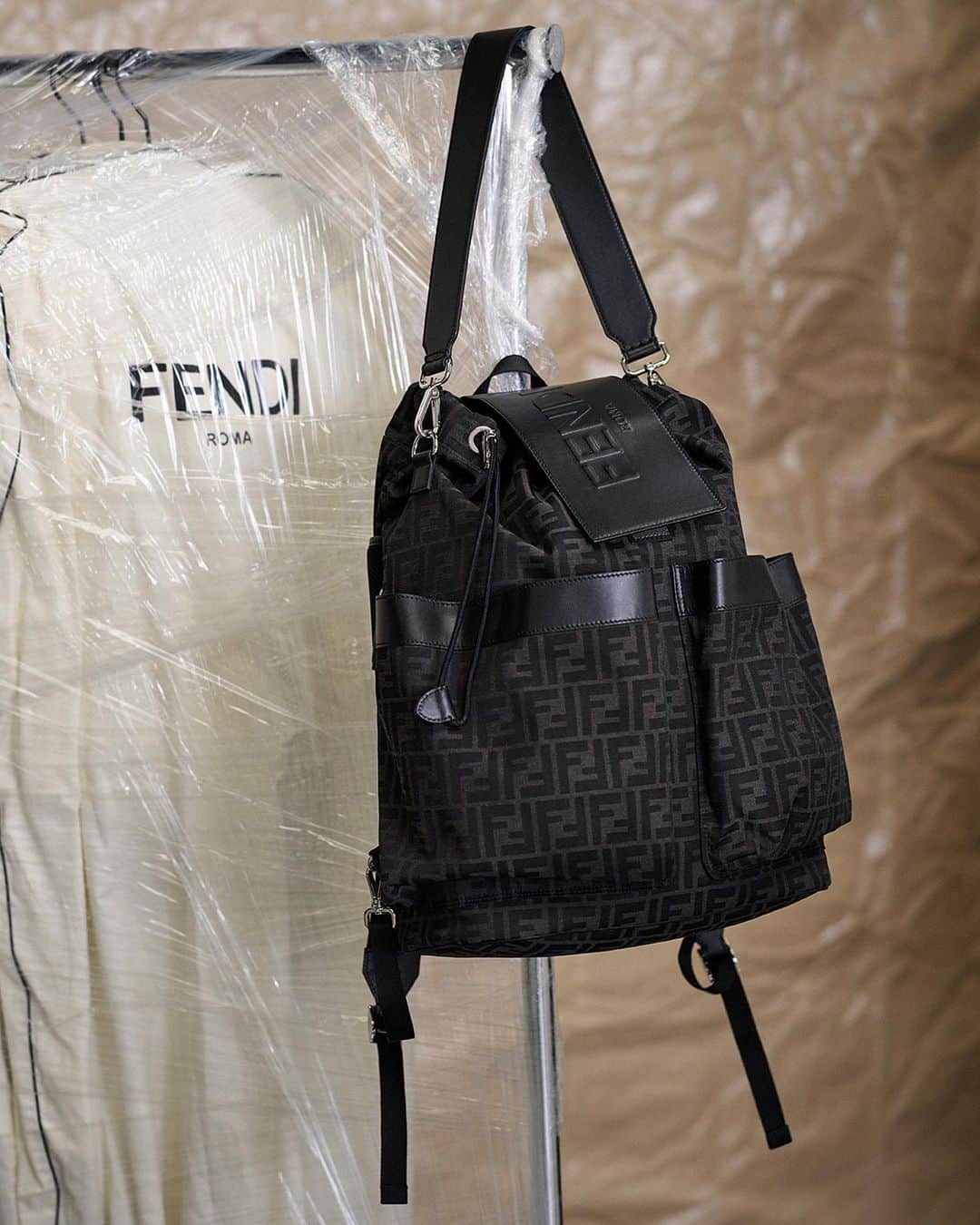 Fendiのインスタグラム：「Essentials in a stripped back shot.   Shop the Fendi Strike Backpack and small leather goods at Fendi.com.  Artistic Director of Accessories and Menswear: @silviaventurinifendi  Artistic Director of Jewelry: @delfinadelettrez  Photography: @brunostaub  Styling: @ganio  Set Design: @mattjacksonmattjackson」