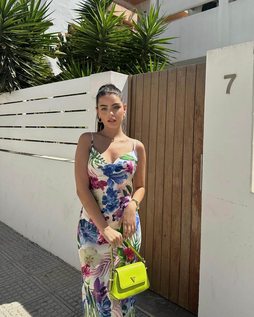 ゲスのインスタグラム：「@carlotaaaatorres glistening in the #GUESSEco Slip Dress & Desideria Shoulder Bag 💫 #GUESSHandbags   ♻️ The Eco Slip Dress is made from plastic bottles.」