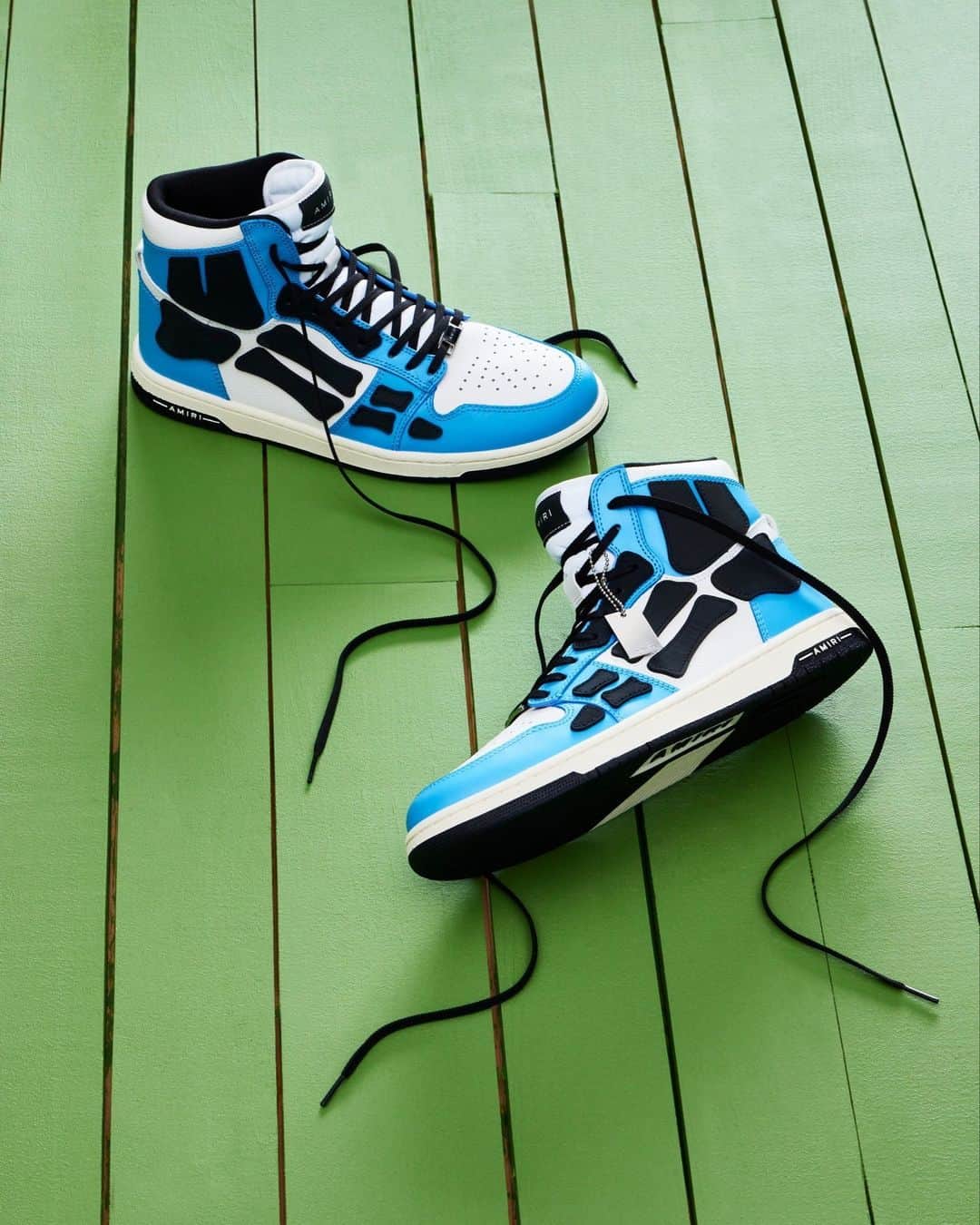 のインスタグラム：「@amiri Skeleton high-top sneakers feature appliqué details and contrast paneling.」