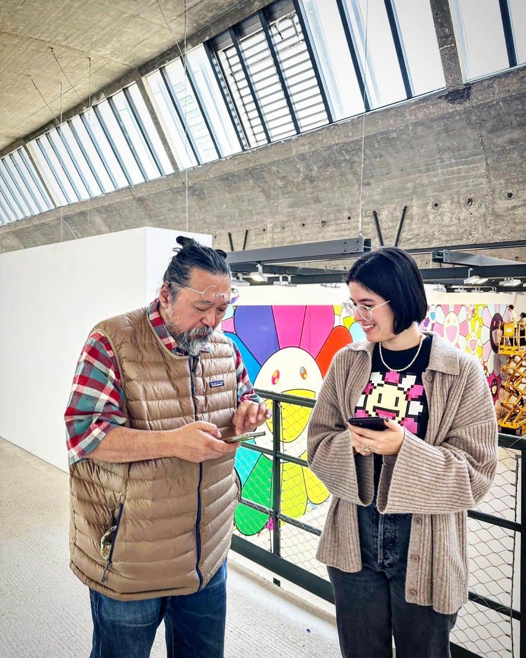 村上隆さんのインスタグラム写真 - (村上隆Instagram)「Ashley @ashleyoverbeek from Gagosian @gagosian NY and me. I met her last year at Gagosian NY when I had an exhibition of NFT-related works. I believe she had been with Gagosian for only a few months at the time, but she had worked in digital marketing at McKinsey. She also has a profound understanding and knowledge of NFT-related issues, and I have been able to consult with her on a variety of topics. Last year's exhibition was a great success, including the impeccable timing! And now, in 2023: Though we are said to be in a crypto winter, I have been creating and presenting works on themes I have encountered in my involvement with NFT. Yesterday, we went over the steps for issuing the exclusive, free NFT to be issued only here at Gagosian, Le Bourget in a few days. I had been informed that it takes 27 seconds for the staff to input the necessary information in one of the steps, but when Ashley demonstrated it yesterday, it only took her 18 seconds! That's fast! We are expecting about 300 people to show up for the free mint—we look forward to seeing you here! Rather then follow the trends of the times, I, MUrakami, intend to continue to create art in which crypto and I overlap. ※※※※※※※※※※※※※※※ At the opening of my exhibition "Understanding the New Cognitive Domain" at Gagosian, Le Bourget, I am offering a special NFT gift. This will be available for free exclusively to visitors who attend the opening reception on Saturday, June 10!  The Flower Jet Coin NFT—named after the jets that fly into the active airport that surrounds the gallery—will be minted on demand for anyone who enters the giveaway booth line between 3 and 6pm.  #TakashiMurakami #Gagosian @murakami.flower2022 @niftykitapp   photo: @chiaki_kasahara_」6月7日 16時14分 - takashipom
