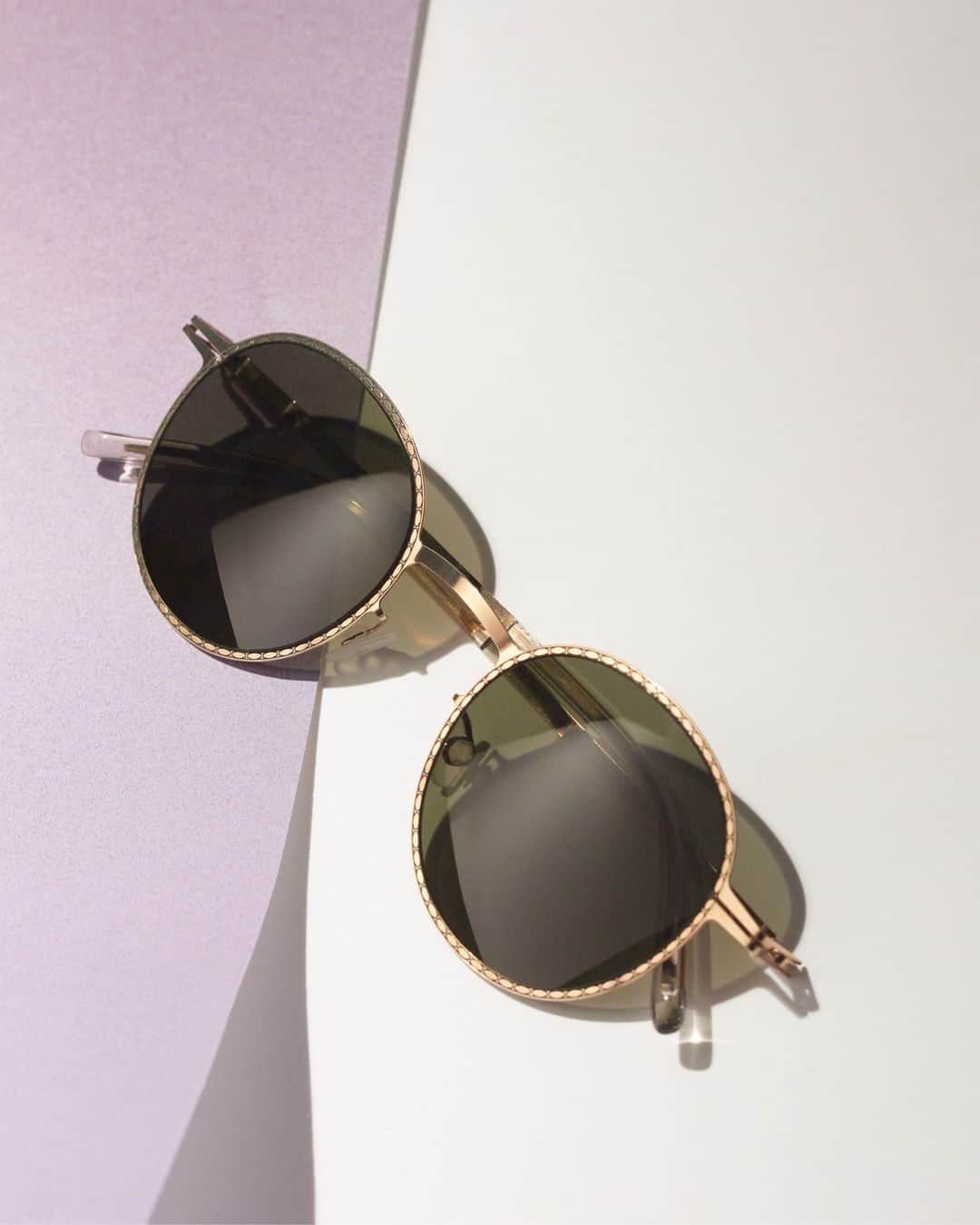 MYKITAのインスタグラム：「Metallic frames with decorative surfaces fit to the Boho renaissance vibe of the summer  NIS in Champagne Gold/Black with Raw Green Solid lenses  Handcrafted at the MYKITA HAUS in Berlin」