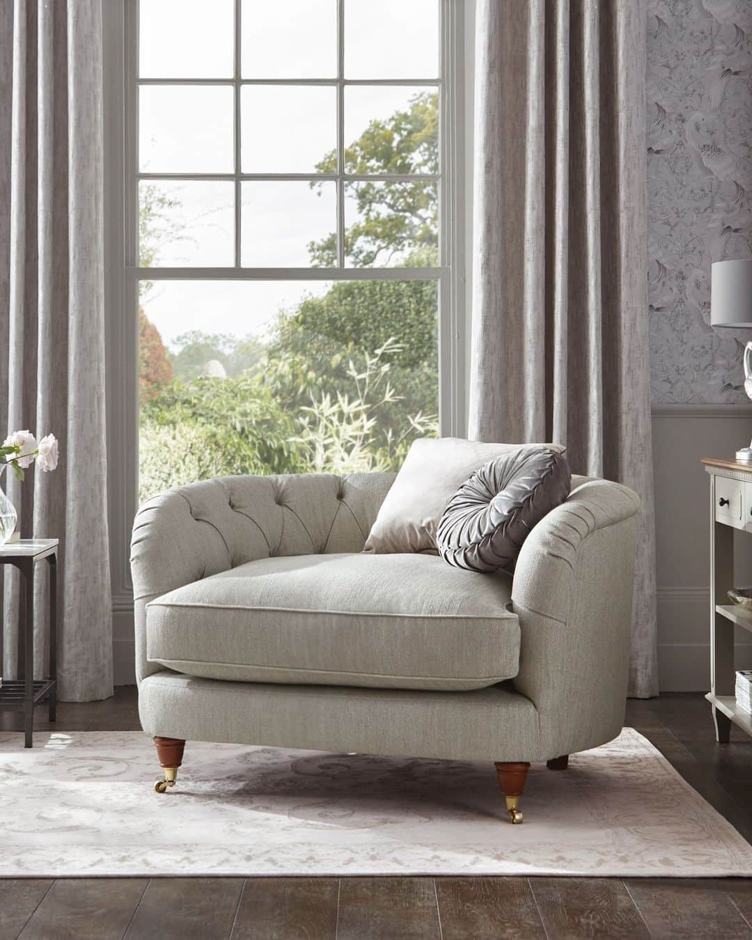 ローラアシュレイのインスタグラム：「Classically ornate, the Hathersage Snuggle is an elegant new shape with a buttoned front and sumptuously soft seating cushion. Made in the UK, this striking chair will make a great addition to your home.⁣ ⁣ Now available to order on lauraashley.com and @nextofficial」