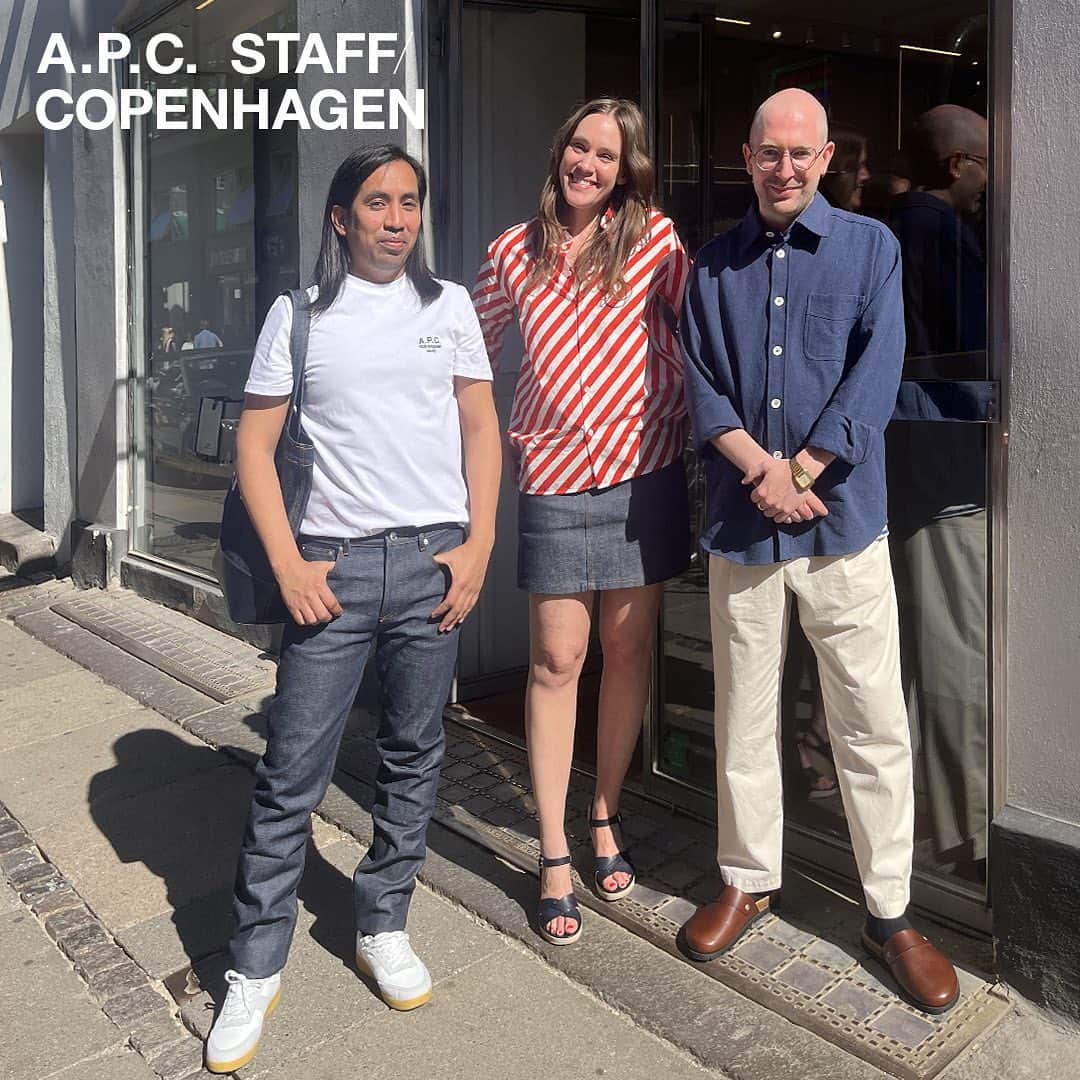 アーペーセーのインスタグラム：「A.P.C. Copenhagen staff in Denmark.  Omar wears: Raymond T-shirt in white New Standard Jeans in indigo Plain sneakers in camel   Fru wears: Rosie shirt in red Standard skirt in indigo Judith sandals in dark navy  Simon wears: Aston overshirt in blue Renato trousers in ecru Danny mules in nut brown  A.P.C. COPENHAGEN 8 Kronprinsensgade 1114 Copenhagen, Denmark  All articles available in stores and at apc.fr⠀  #APCstaff #APCstore #APC #Copenhagen」