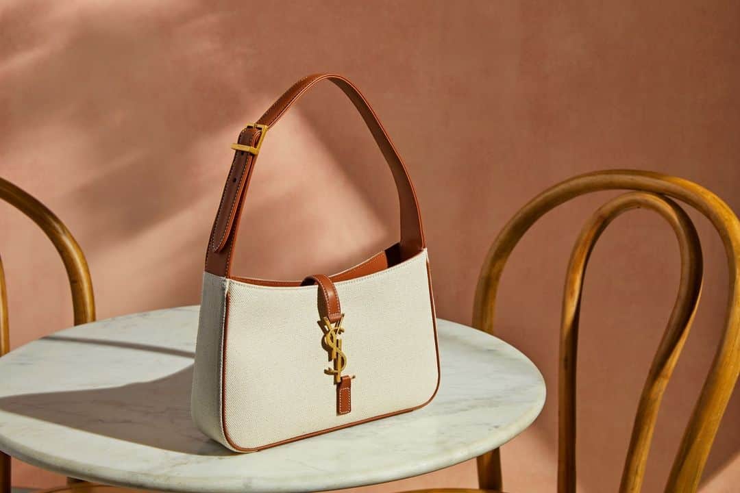 のインスタグラム：「@ysl Hobo bag made with organic cotton, featuring an iconic YSL signature hook closure.」