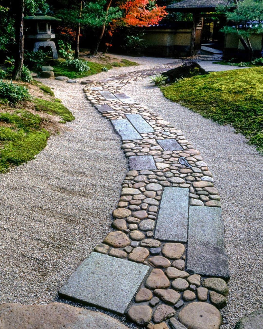 Michael Yamashitaのインスタグラム：「The right path: in a Japanese tea garden,  the path that takes you there is almost as important as the garden itself. Foot paths convey the mood of the garden. Stepping stones of irregular sizes slow the visitors pace. Twists and turns focus the stroller towards the designers intended views. Intricate patterns encourage the viewer to look down to admire the beauty of their design. And bowing  the head also has the effect of putting the visitor into a meditative state of mind. #japanesegardens #japanesegardendesign #teagardens」