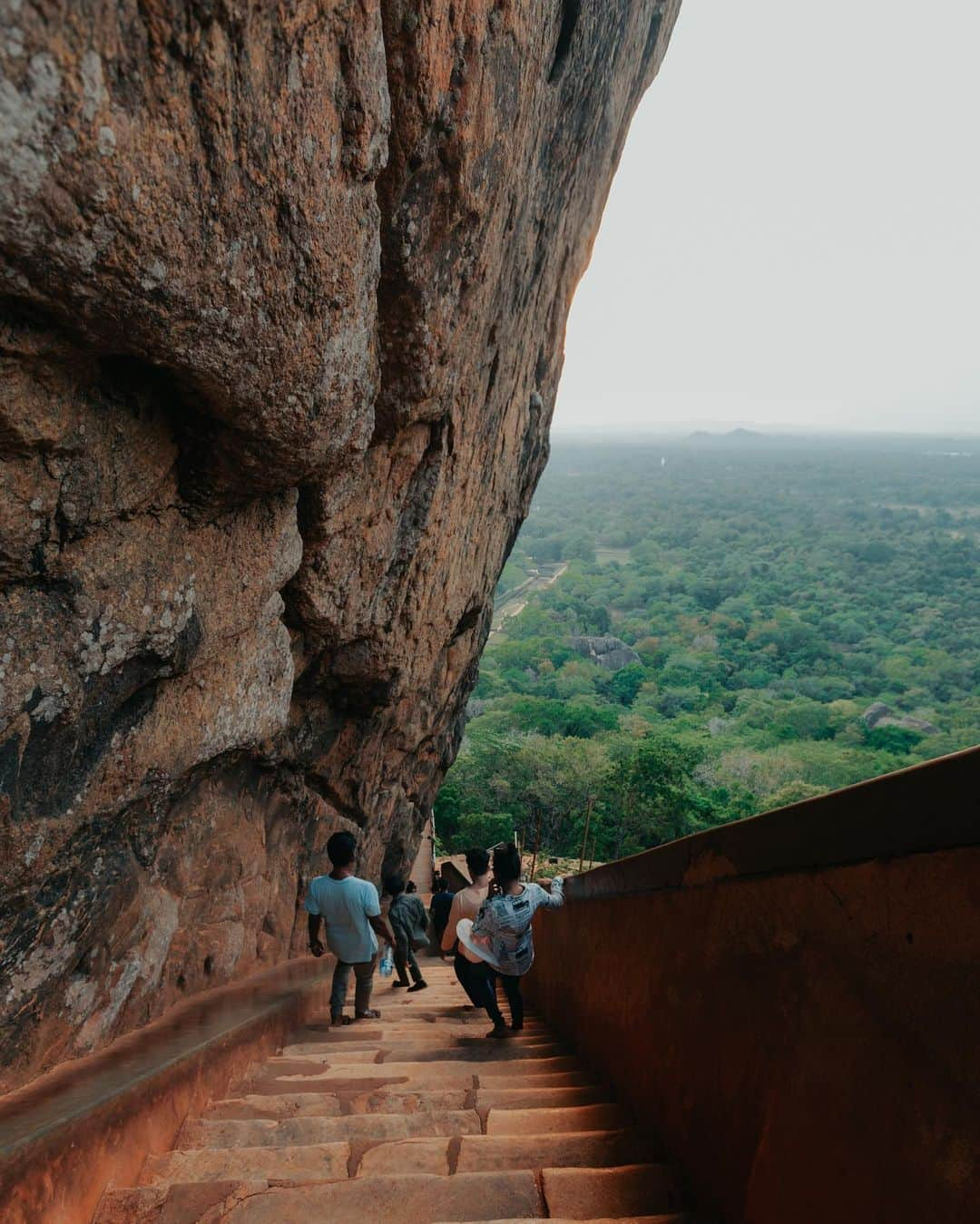 Putri Anindyaさんのインスタグラム写真 - (Putri AnindyaInstagram)「The ancient rock fortress Sigiriya //   Sigiriya or Sinhagiri is a massive landmark at the middle of Sri Lanka. I went there at the sunset time but didn’t get to the top because I was kinda afraid to go up and had to go down when it’s dark. There are approx 1200 steps of stairs to go to the top. I climbed until The last stairs before the top as you can see on the 6th slide. It looks like a lion’s gate.   The name of this place is derived from this structure; Sīnhāgiri, the Lion Rock (an etymology similar to Sinhapura, the Sanskrit name of Singapore, the Lion City).  It was used as a Buddhist monastery until the 14th century. Sigiriya today is a UNESCO listed World Heritage Site. It is one of the best preserved examples of ancient urban planning.   Truly one of the best ancient landmark I’ve seen in my life. I felt like Short Round of Dr Jones at that moment lmao.」6月14日 19時26分 - puanindya