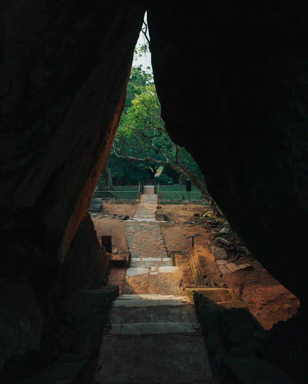 Putri Anindyaさんのインスタグラム写真 - (Putri AnindyaInstagram)「The ancient rock fortress Sigiriya //   Sigiriya or Sinhagiri is a massive landmark at the middle of Sri Lanka. I went there at the sunset time but didn’t get to the top because I was kinda afraid to go up and had to go down when it’s dark. There are approx 1200 steps of stairs to go to the top. I climbed until The last stairs before the top as you can see on the 6th slide. It looks like a lion’s gate.   The name of this place is derived from this structure; Sīnhāgiri, the Lion Rock (an etymology similar to Sinhapura, the Sanskrit name of Singapore, the Lion City).  It was used as a Buddhist monastery until the 14th century. Sigiriya today is a UNESCO listed World Heritage Site. It is one of the best preserved examples of ancient urban planning.   Truly one of the best ancient landmark I’ve seen in my life. I felt like Short Round of Dr Jones at that moment lmao.」6月14日 19時26分 - puanindya