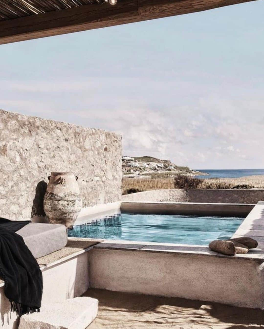 The Cool Hunterさんのインスタグラム写真 - (The Cool HunterInstagram)「Here are some previews of  @nomad_mykonos where the breeze of the Aegean sea, the warmth of the sun, and the beauty of exquisite design set the stage for a truly relaxing holiday.  We love the feel of isolation and calm that are so complete at @nomad_mykonos No need to go anywhere at all, not even to the gorgeous Elia beach, as the 14 luxury villas are so perfectly appointed with their own pools and expertly served that one hardly ever needs to leave the villa.   Except to relax by the pool or enjoy the best Greek breakfasts and lunches or dinners that are sometimes prepared and enjoyed by the outdoor fireplace. A car is recommended as a Nomad is a 20 minute drive into town. Bohemian luxury as it’s best. #swipeleft」6月16日 14時25分 - thecoolhunter_