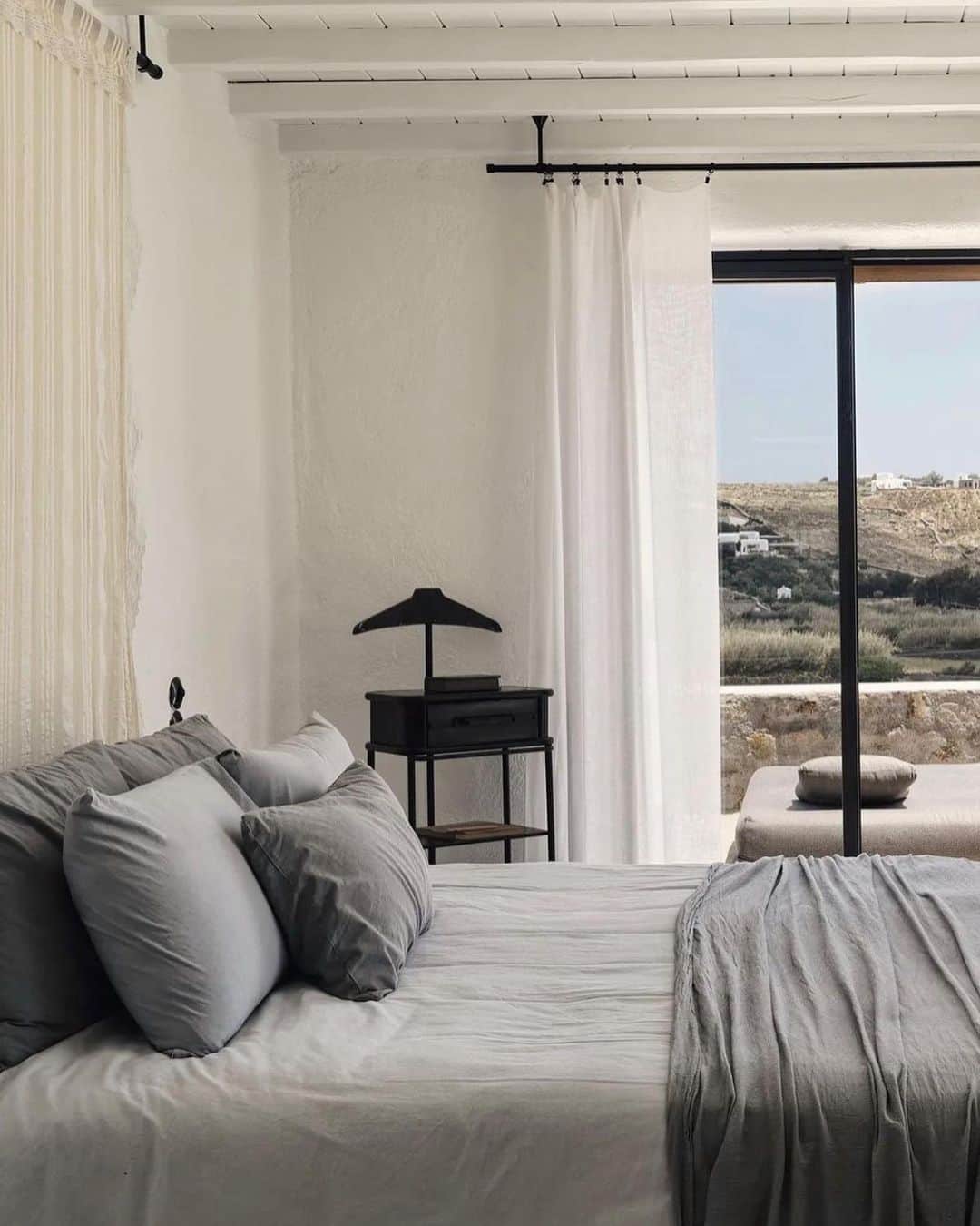 The Cool Hunterさんのインスタグラム写真 - (The Cool HunterInstagram)「Here are some previews of  @nomad_mykonos where the breeze of the Aegean sea, the warmth of the sun, and the beauty of exquisite design set the stage for a truly relaxing holiday.  We love the feel of isolation and calm that are so complete at @nomad_mykonos No need to go anywhere at all, not even to the gorgeous Elia beach, as the 14 luxury villas are so perfectly appointed with their own pools and expertly served that one hardly ever needs to leave the villa.   Except to relax by the pool or enjoy the best Greek breakfasts and lunches or dinners that are sometimes prepared and enjoyed by the outdoor fireplace. A car is recommended as a Nomad is a 20 minute drive into town. Bohemian luxury as it’s best. #swipeleft」6月16日 14時25分 - thecoolhunter_