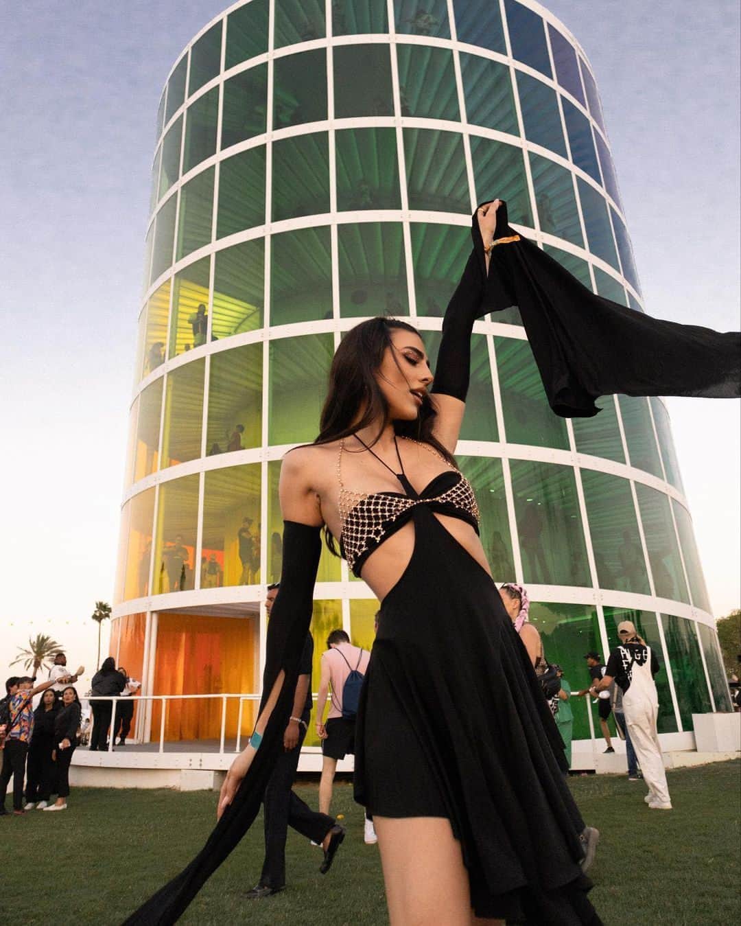 トラサルディのインスタグラム：「@giuliasalemi seen in a flowing black jersey dress with cape sleeves from #TrussardiSS23.」