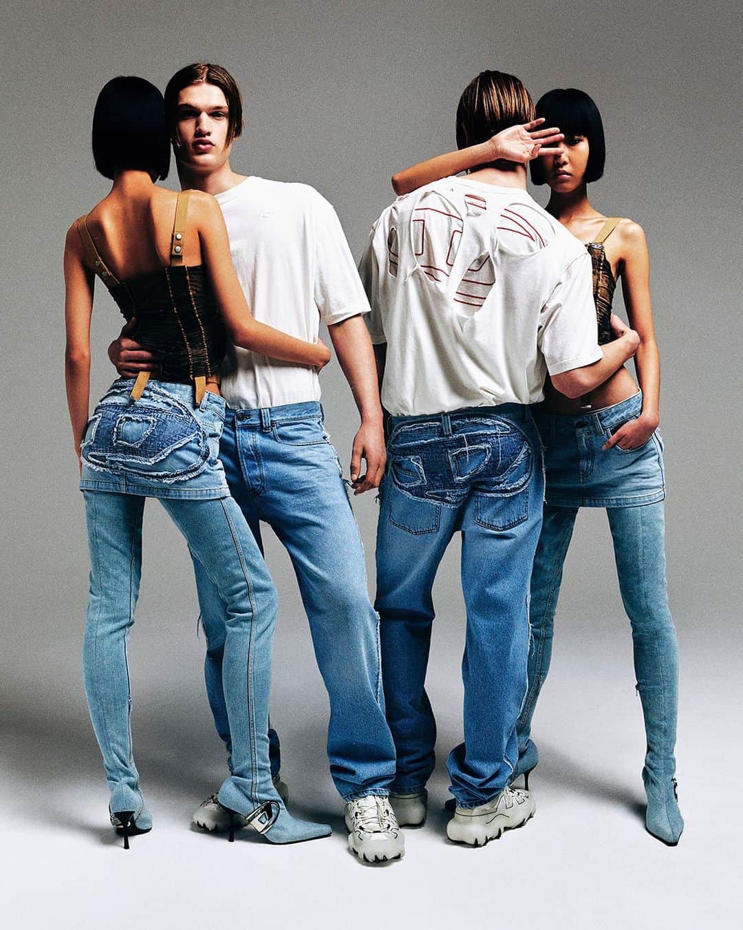 ディーゼルのインスタグラム：「Made you look.  Diesel's new Oval D Embroidered denim from #DieselFW23 draws the gaze to the backside of a mini skirt and relaxed fit jeans. An extra-large patchwork Oval D logo is applied over the seat of the new styles giving them a witty, vintage hand-crafted take on logomania.  Discover more at the link in bio.  #ForSuccessfulLiving」