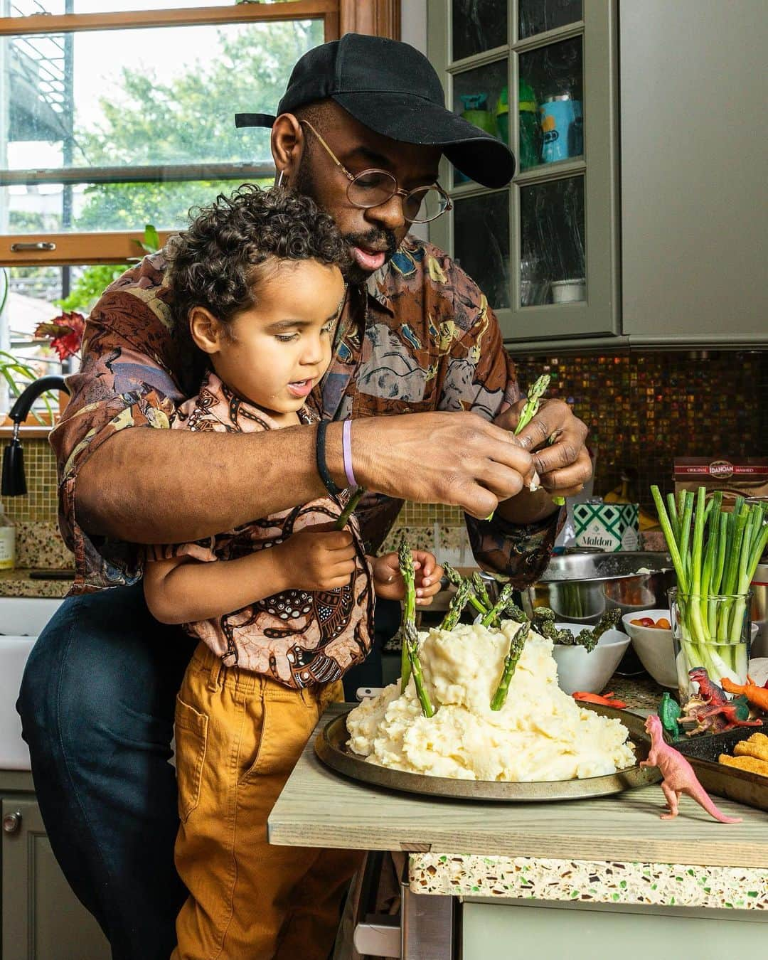 Paul Octaviousのインスタグラム：「In a surreal move, Seb and I were featured in the @nytimes for our theatrical cooking abilities of Mash Potato Volcano with a side of mushroom gravy lava 😍❤️   I love being a gay/queer parental with Sebs mommas @juliepurpura @drepurps. It’s been one of the  moments life made alittle more sense with him around!  Thanks to @lucyhewett for capturing this beautiful moment and being featured in the times! Also thanks to JJ Goode for including us.   #fathersday #nytimes」