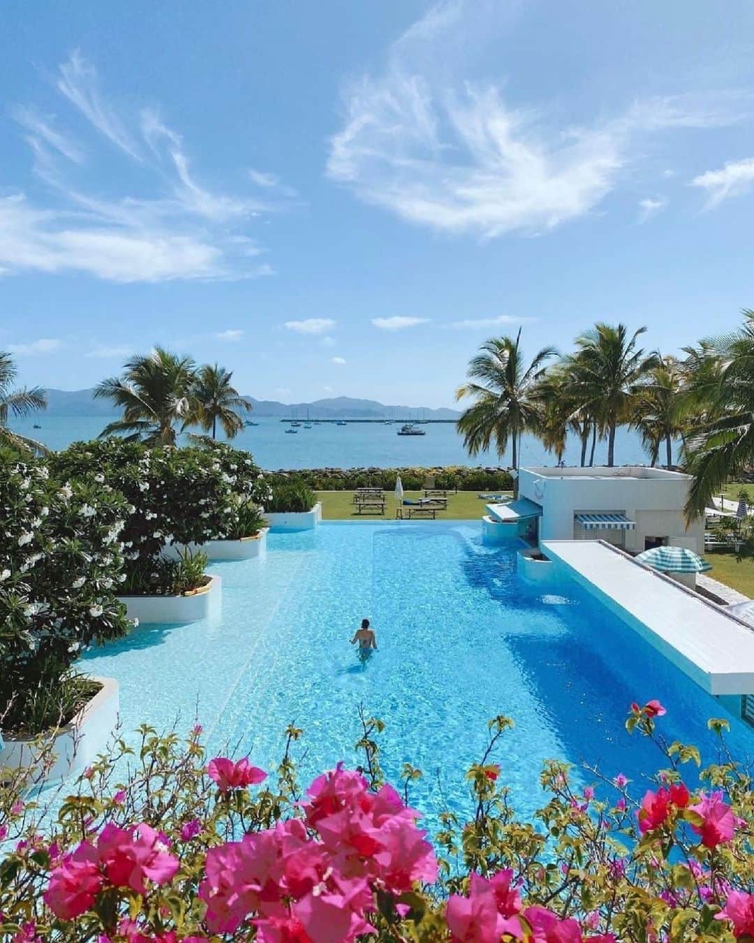 Australiaのインスタグラム：「Just another day in paradise 🌺 Captured here by @ashleighbridget, you'll find @thevilletsv in @townsvillenorthqueensland, a dreamy resort that's conveniently located near some epic @queensland experiences. Go on a day trip to dive into @moua_museum_of_underwater_art's latest exhibition at their #underwatermuseum, or hop over to @thisismagneticisland and explore the sights with @aquascenecharters_. After a day of adventures, relax poolside with a cocktail in hand to take in the sunset - yes, please! #seeaustralia #comeandsaygday #thisisqueensland #townsvilleshines」