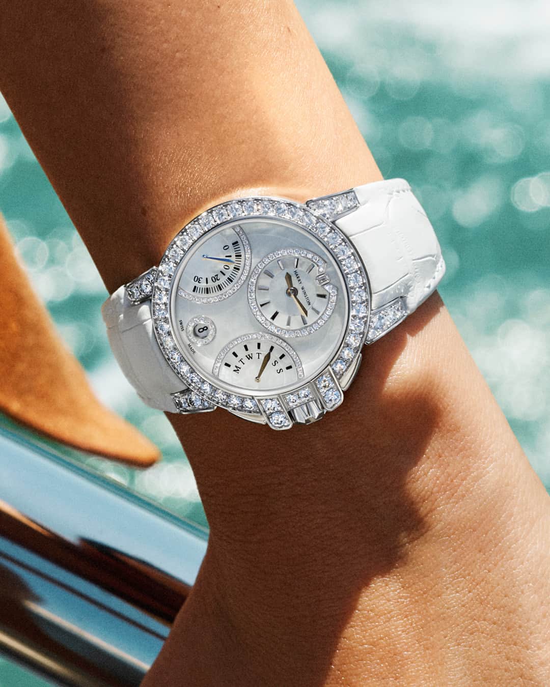 ハリー・ウィンストンのインスタグラム：「A lustrous white beaded mother-of-pearl dial and a splash of sparkling diamonds capture the wonders of the ocean. Tap the link in bio to adorn your wrist with the Ocean Biretrograde Automatic 36mm timepiece this summer. #HarryWinston #HWOcean」