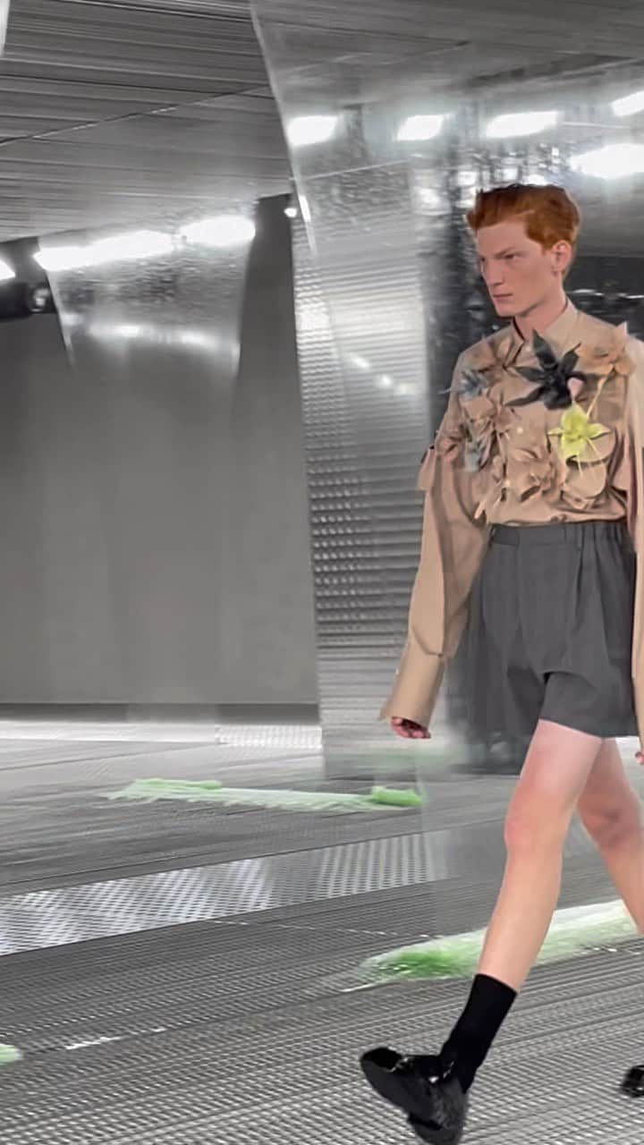 AnOther Magazineのインスタグラム：「“Often we speak about reduction – here, instead, from something simple we expand” – Miuccia Prada on her @prada S/S24 show with @rafsimons ❤️   At Milan’s Fondazione Prada, models walked between curtains of slime in ensembles that addressed the concept of fluidity. Liberating the body and confounding the usual limitations of tailoring, shirting and suiting was softened and lightened, representing a new sense of fragility in menswear.  🎥 by @alexanderfury @jordanduddy」