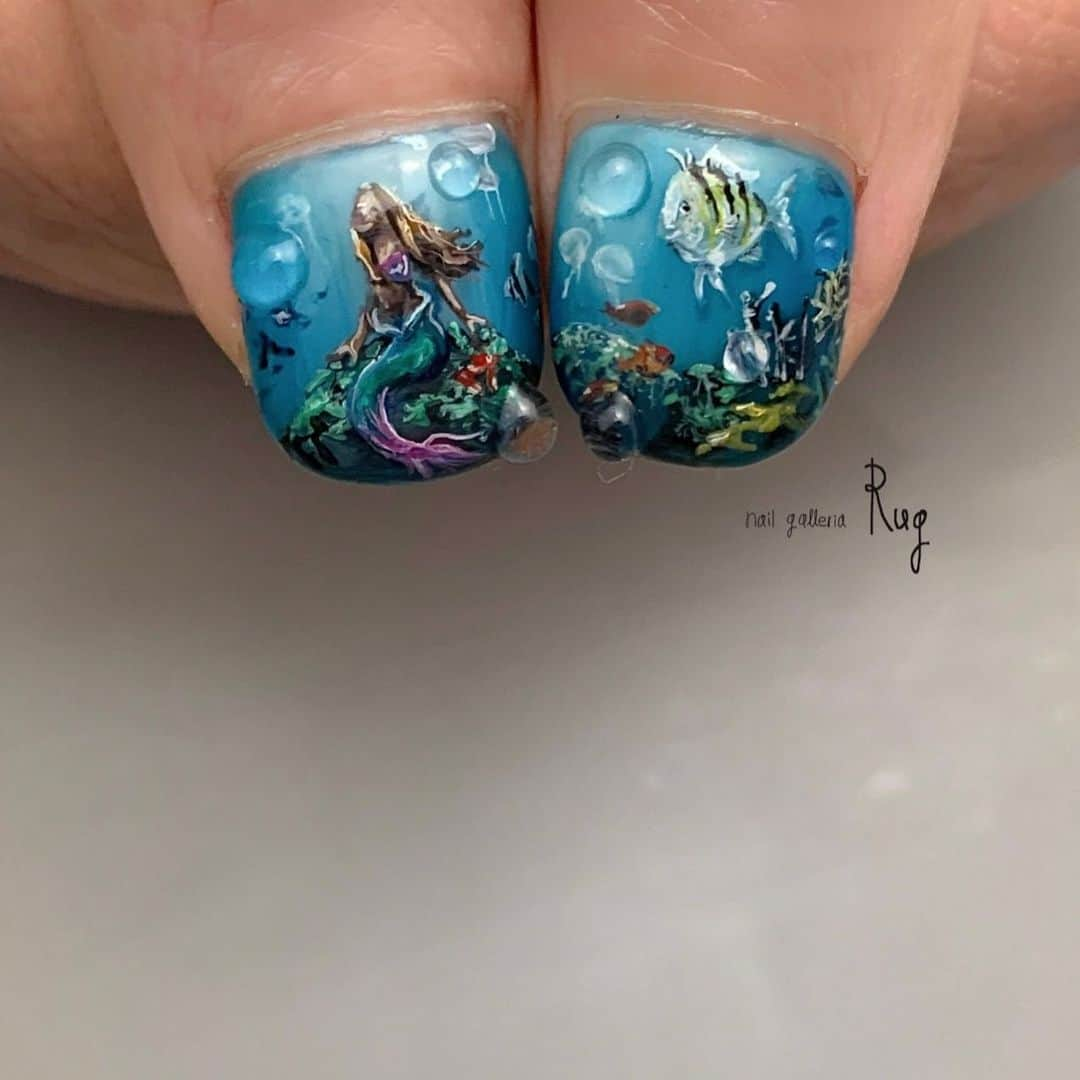 aoki_nailさんのインスタグラム写真 - (aoki_nailInstagram)「・ The Little Mermaid🐚 #littlemermaid   公開記念💫 ネイルも今やジェンダーレス こちらメンズネイルです  いつもありがとうございます🌼  nailgalleria  Rug〈ラグ〉 大阪市北区中崎西2-6-3  #rugペイントD #絵画ネイル#絵画ネイル大阪　#アートネイル#大阪ネイルサロン#手描きアート#手描きデザイン#手描きネイル#アートネイル#thelittlemermaid  #handpaint#paintart#nailistagram#kawaii#japanesenailart#アリエルネイル#disneyland #アリエルコーデ #nails#イラストネイル#絵画ネイル#絵画ネイル大阪#rugartsample#ディズニー仕様#ディズニーネイル#ディズニーコーデ」6月21日 0時22分 - aoki_nail