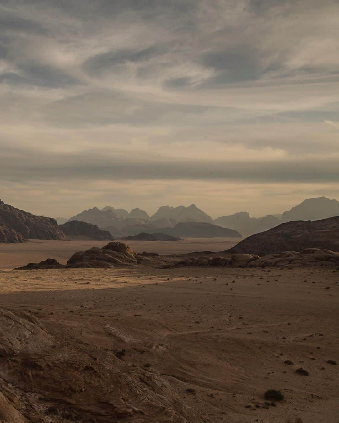 ジョン・スタンメイヤーさんのインスタグラム写真 - (ジョン・スタンメイヤーInstagram)「Going through the archive this morning for a collaboration project with @moabpaper, I found this photograph. Remembering that late afternoon near Wadi Rum, how other-planetary the landscape of Wadi Hafeer is. Not surprisingly, filmmakers created movies such as Star Wars, The Martian, Dune, and many more in this unimaginable landscape. Even the sky was iluminated with life, talking in whirling language together...🪐 ⠀⠀⠀⠀⠀⠀⠀⠀ from @NatGeo @OutOfEdenWalk #jordon #WadiHafeer #landscape」6月22日 1時20分 - johnstanmeyer