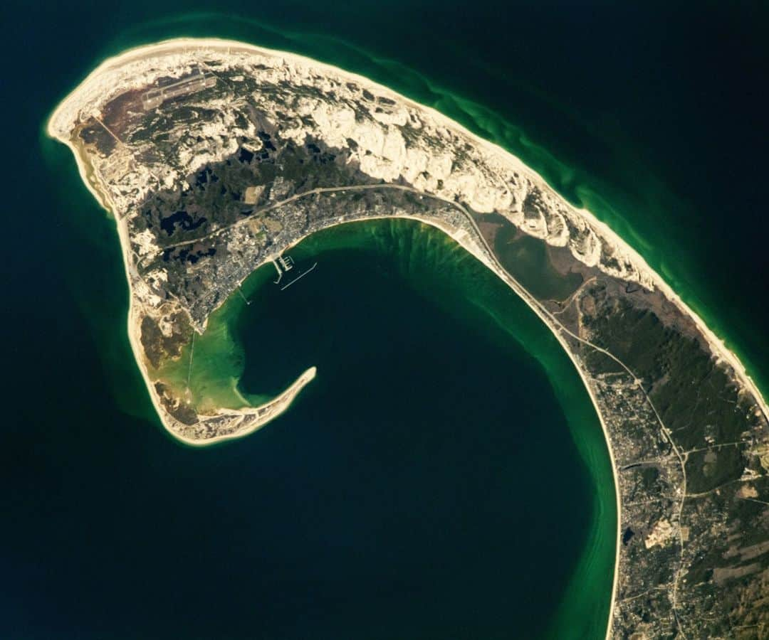 NASAさんのインスタグラム写真 - (NASAInstagram)「An astronaut aboard @ISS captured this photo of the hook shape of the Cape Cod peninsula on April 9, 2023. The peninsula extends about 60 miles from Massachusetts’ southern mainland and serves as a natural barrier between Cape Cod Bay and the Atlantic Ocean.  This unique shape was caused by glacial erosion, movement of the Laurentide Ice Sheet, and natural processes like waves and wind.  This peninsula is home to many ecosystems, with over 450 species of amphibians, reptiles, fish, birds, and mammals, some of which are rare or endangered.  Image Description:  Astronaut photograph of the Cape Cod peninsula, which is shaped like a hook that extends to the left and curves under and to the right. The peninsula has light tan coasts and sand dunes at its crest. Darker patches of dark blue and green-brown indicate freshwater ponds and harbors, respectively. The peninsula is surrounded by the dark blue waters of the Atlantic, though the water is bright green along the coastlines.  #NASA #Space #Earth #CapeCod #Ocean #Water」6月22日 2時22分 - nasagoddard