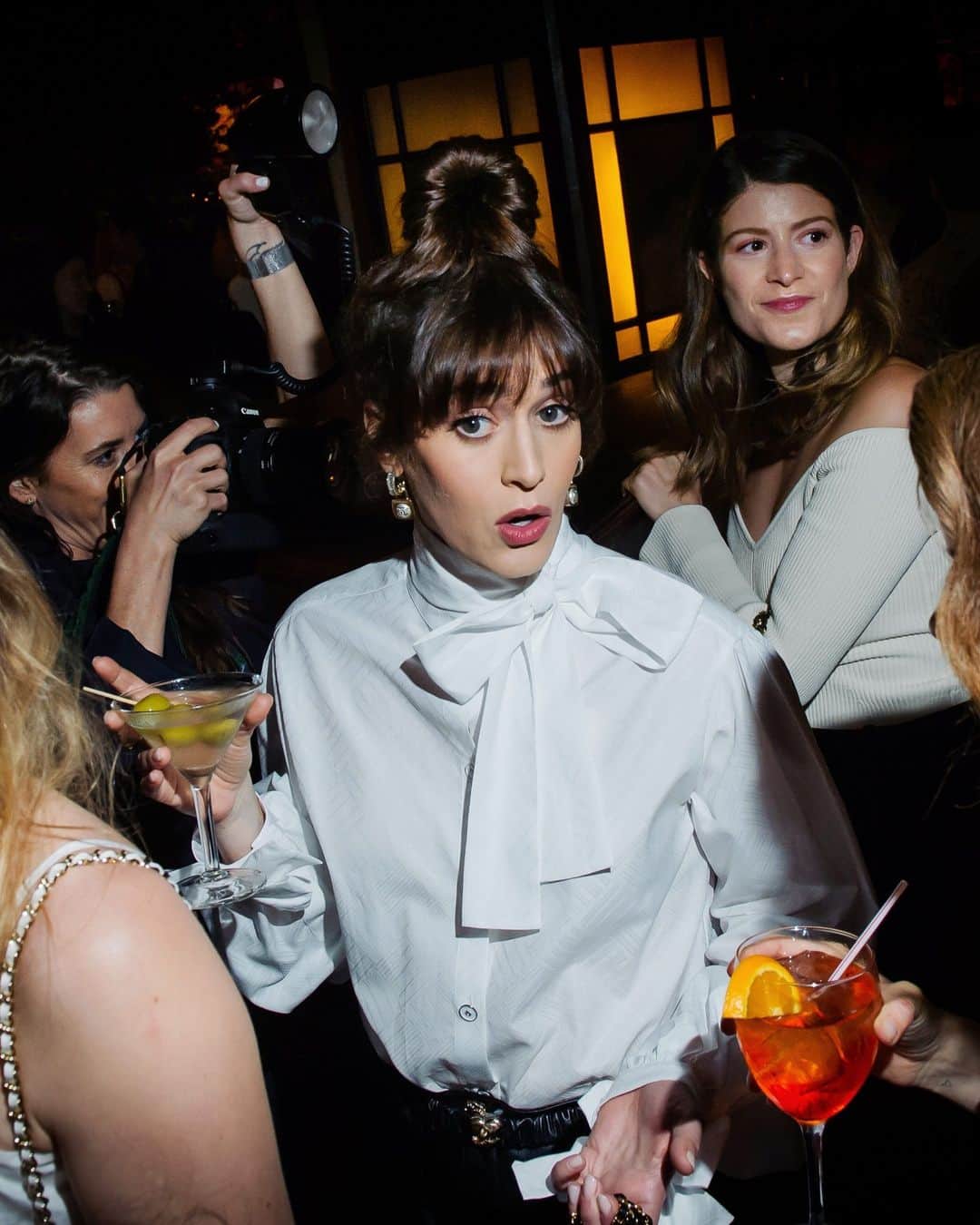New York Times Fashionさんのインスタグラム写真 - (New York Times FashionInstagram)「At parties last week for the Apollo Theater and the Tribeca Film Festival, luminaries of music and film dressed up in ruffles, sequins and tulle.  On Spring Street in SoHo, Chanel hosted the 16th annual Tribeca Festival Artists dinner at Balthazar, honoring women artists who contributed original artwork to the festival’s filmmakers. The crowd included Greta Lee, Tracee Ellis Ross, Renee Cox and Lizzy Caplan. Guests dined on steak frites while flipping through art books, which were placed at each seat.  The actress Zazie Beetz chatted with other guests on a red bench at Balthazar. “I’m feeling Halloween meets 1920s,” she said. “But most of all, I feel very chic.”  In Harlem, the Apollo hosted its annual Spring Benefit, where musicians and philanthropists celebrated the theater’s 90th year and raised more than $2.2 million for the theater. Spike Lee, wearing a maroon Morehouse College jacket, presented an award to Kareem Abdul-Jabbar later in the evening. Raymond P. Lewis opted for ruffles, and Stacey Brooklyn and Susan Shaw flaunted statement accessories.  Tap the link in our bio to see more of the most-dressed guests at both events. Photos by @dina_litovsky and @dollyfaibyshev」6月22日 2時56分 - nytstyle